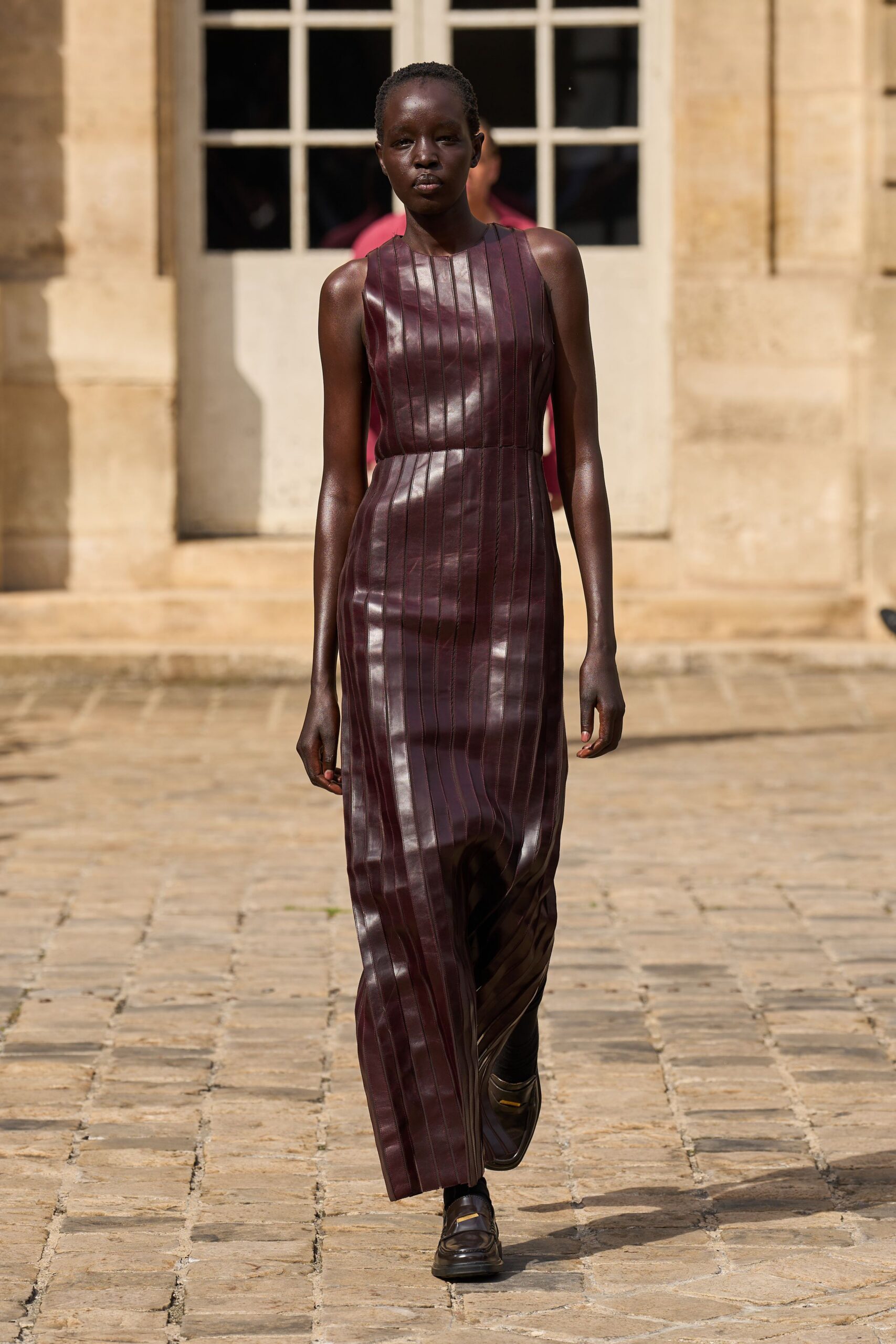 maroon leather sleeveless high-neck fitted pleated maxi gown