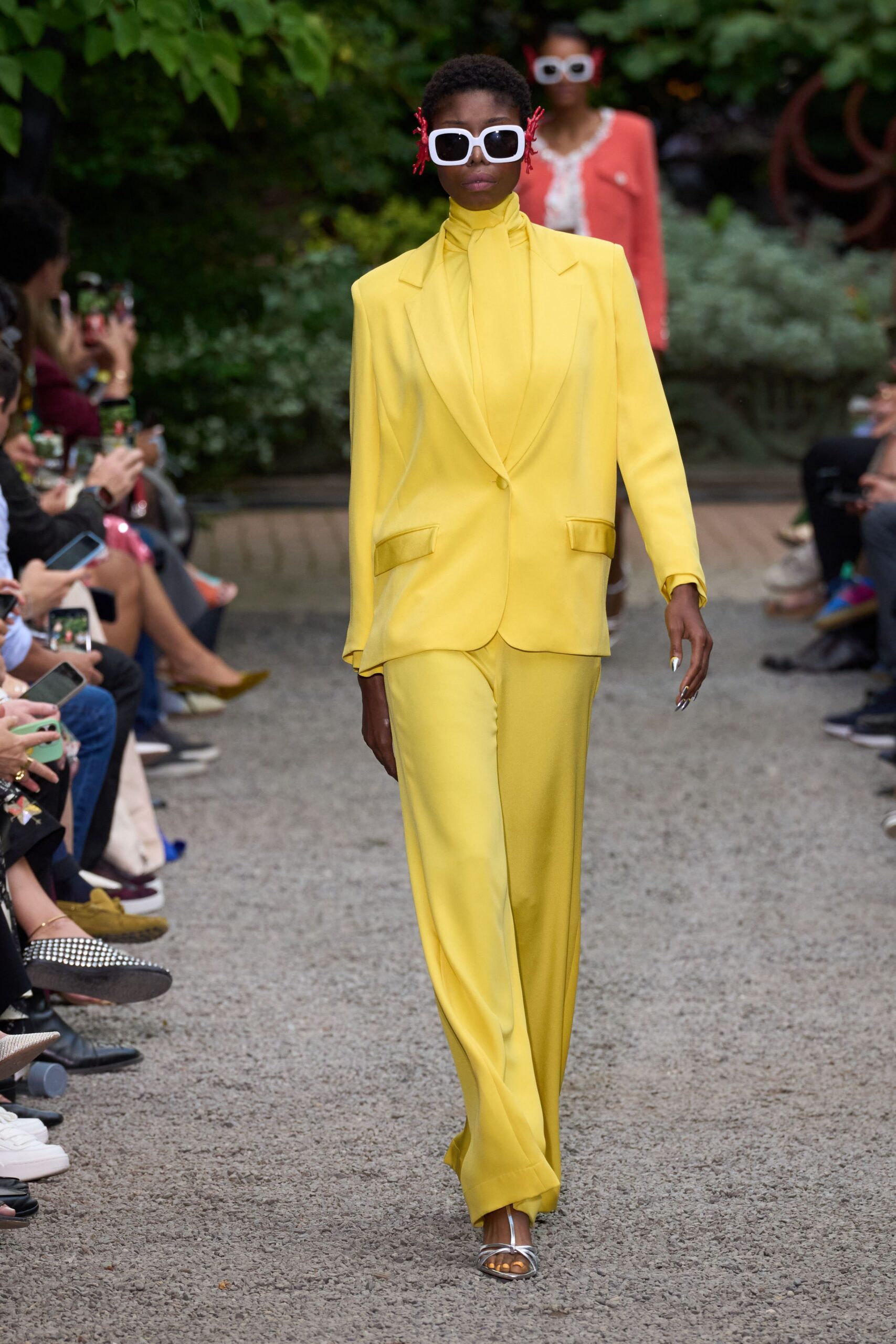 yellow tailored suit with sunglasses