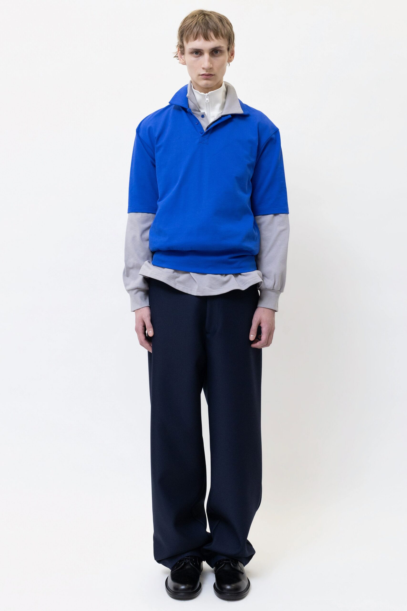 blue relaxed top with black pants