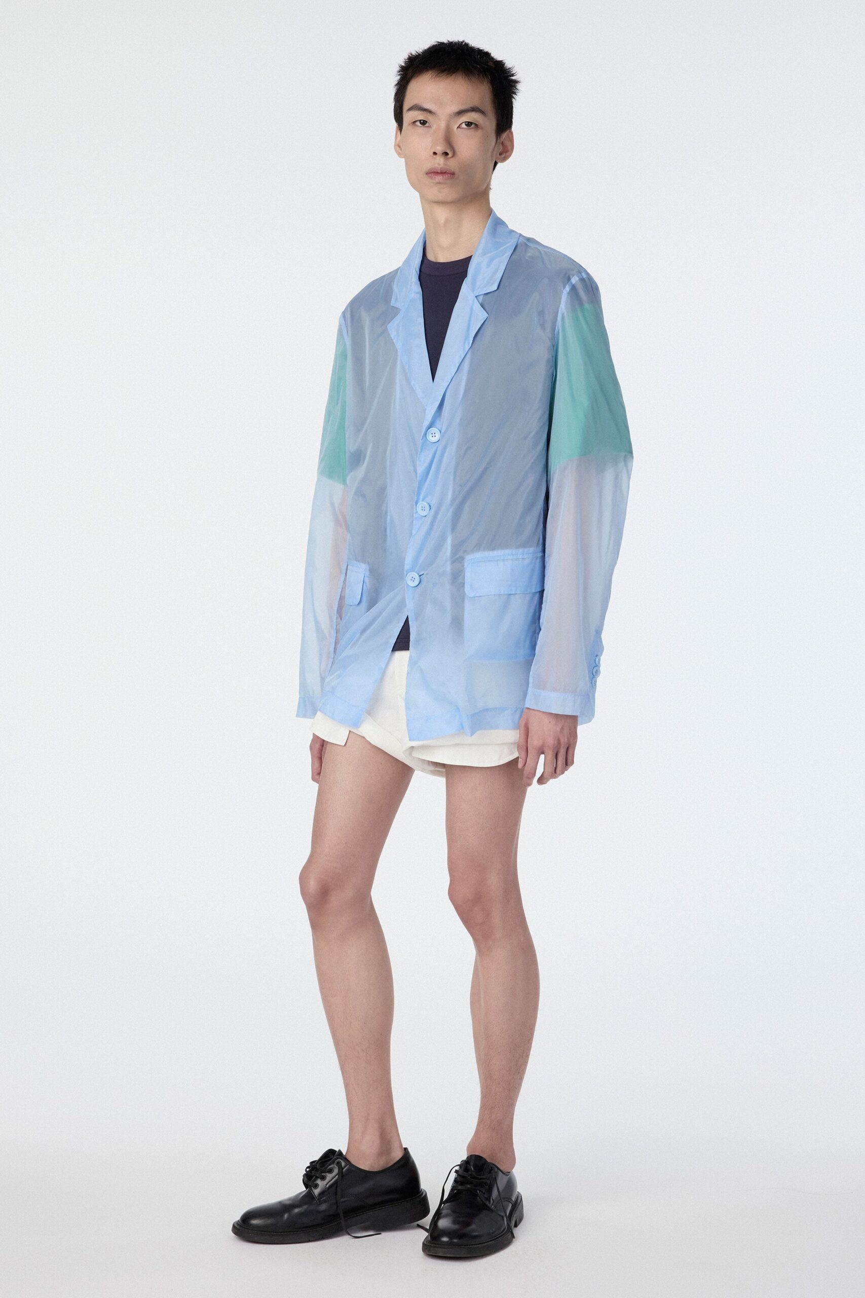 blue vinyl long-sleeve collared relaxed buttoned jacket