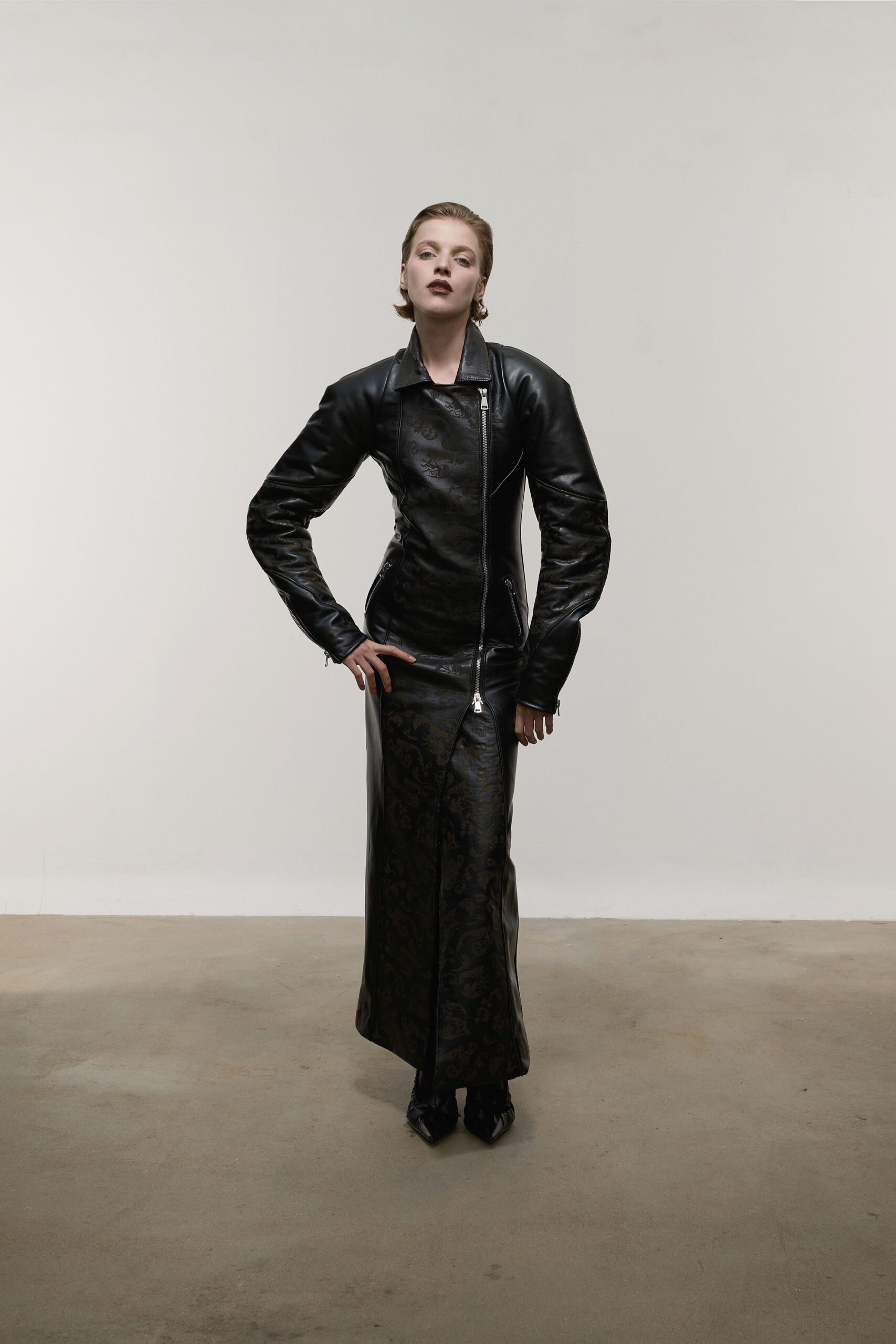black leather fitted jacket and skirt