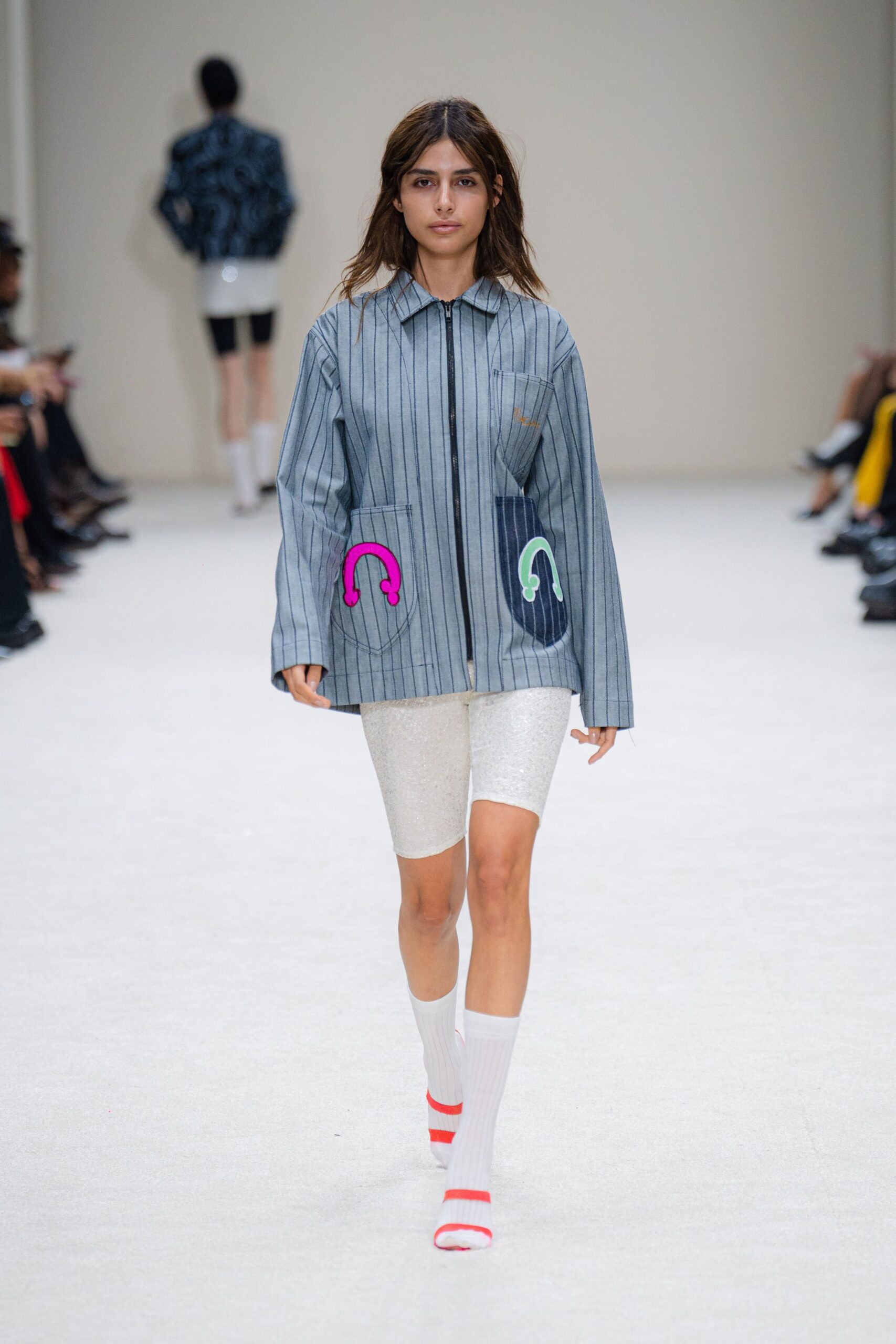 gray striped jacket with white shorts