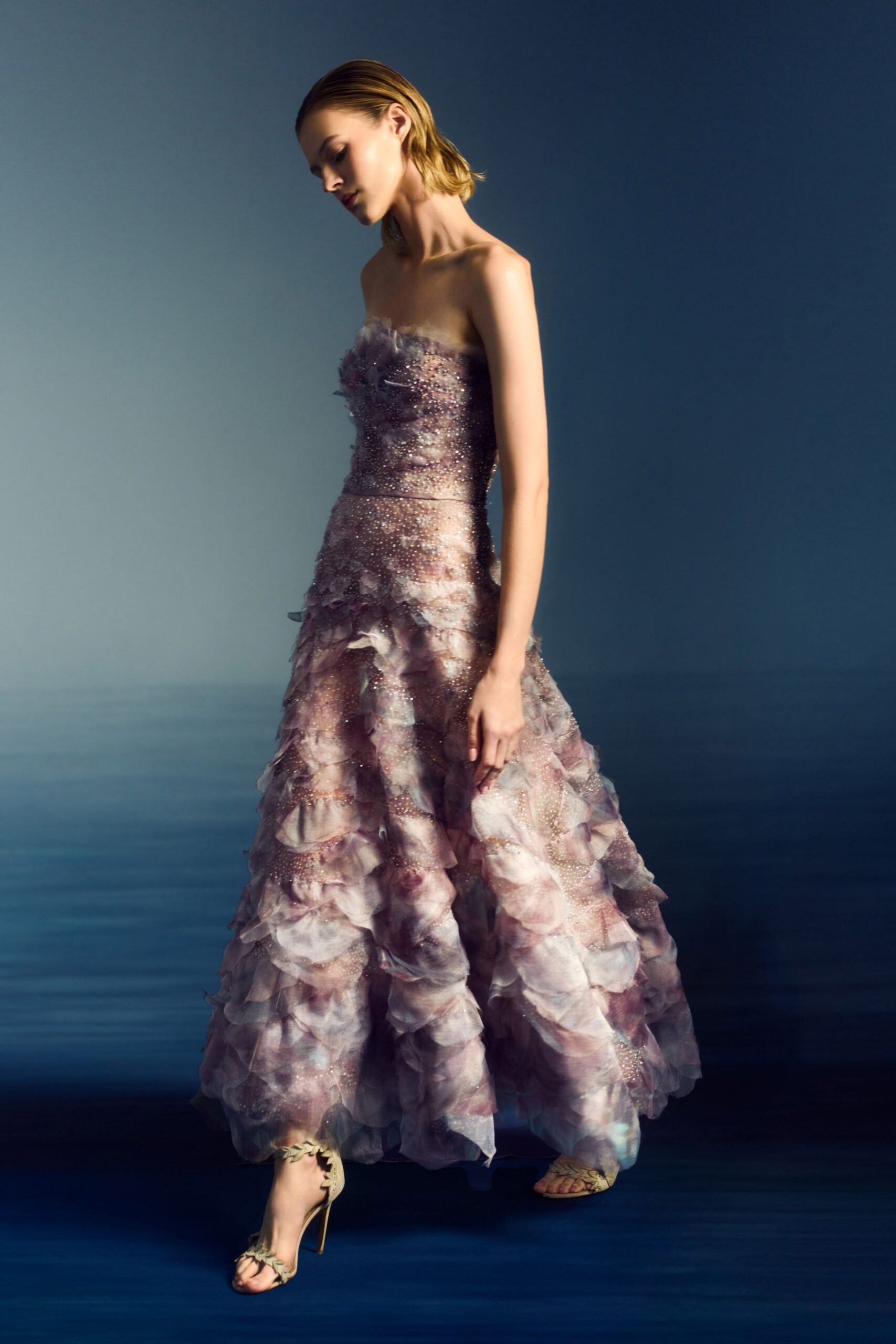 pink silk strapless fitted ruffled layered flowing gown