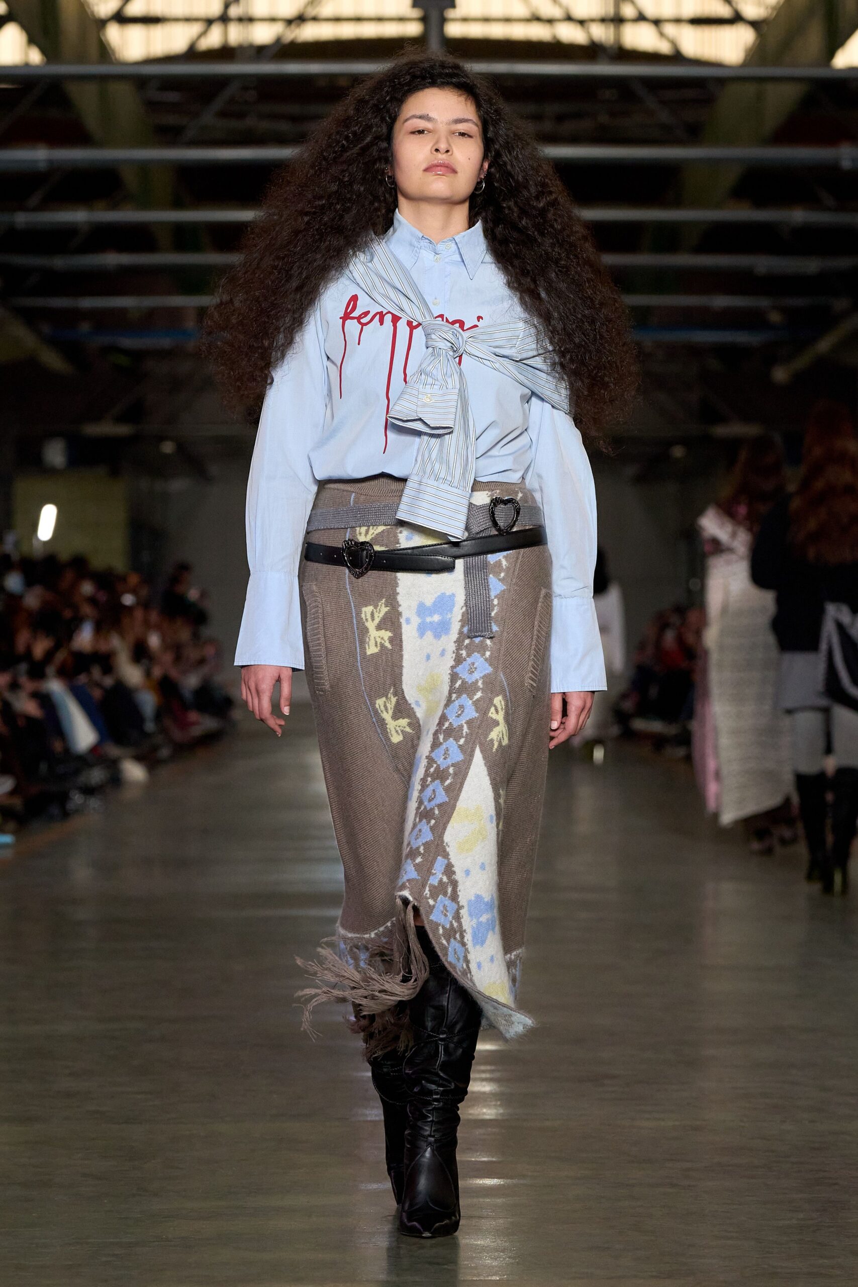 light blue shirt gray skirt black boots