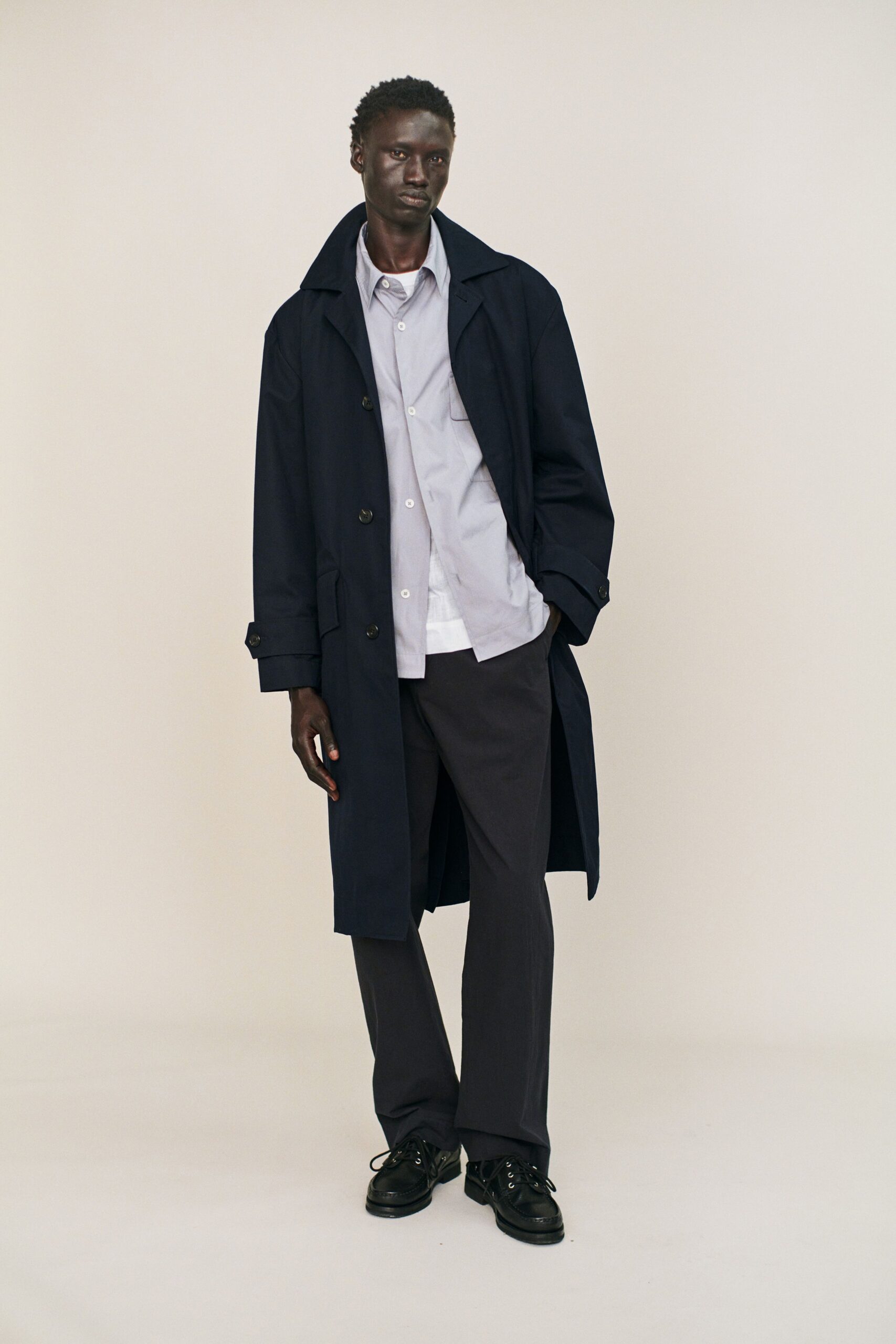 black trench coat with gray pants