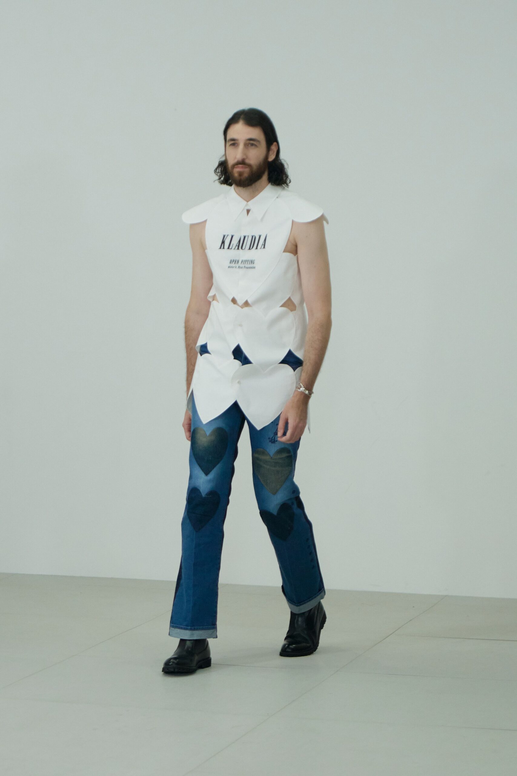 white fitted top with blue pants