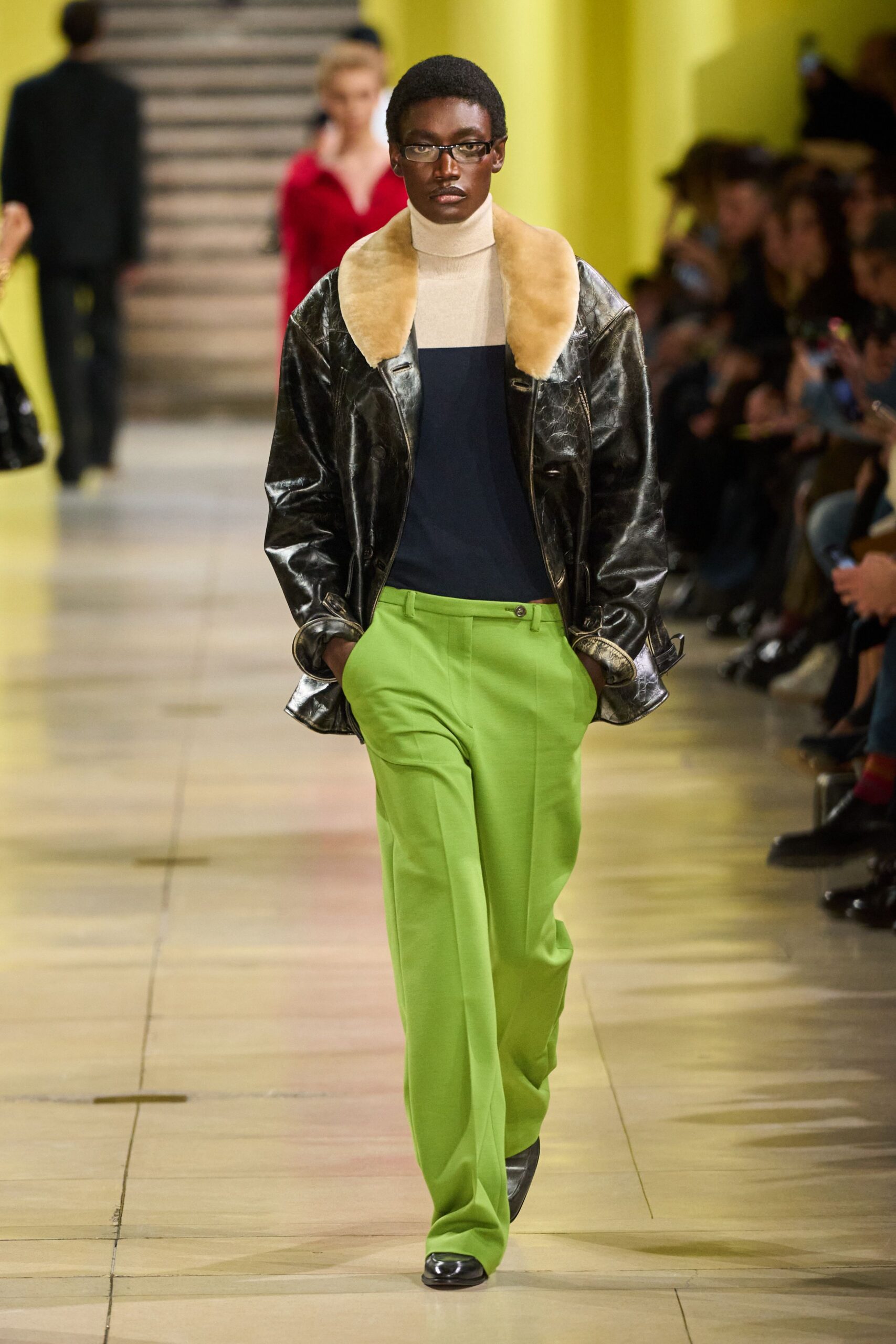 black leather jacket with green pants