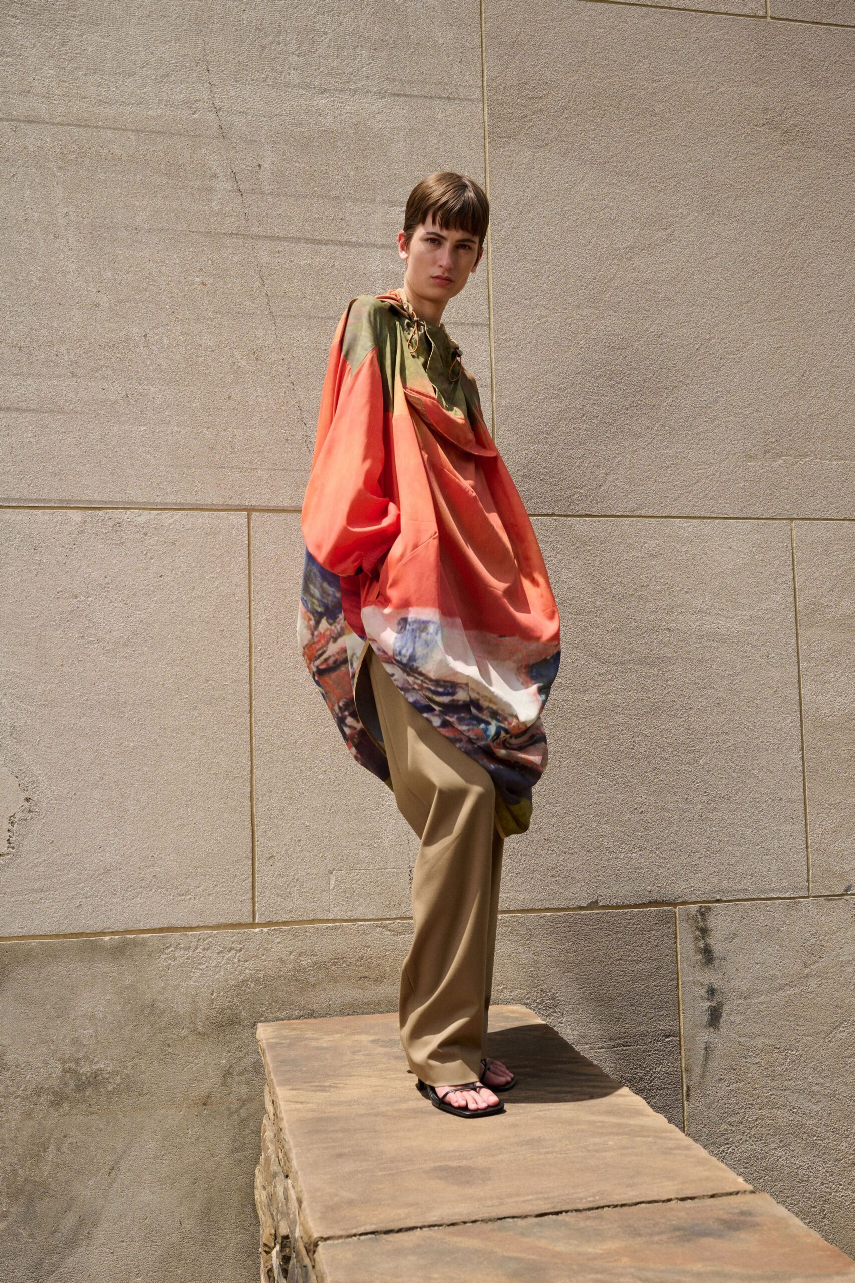 orange relaxed top beige pants