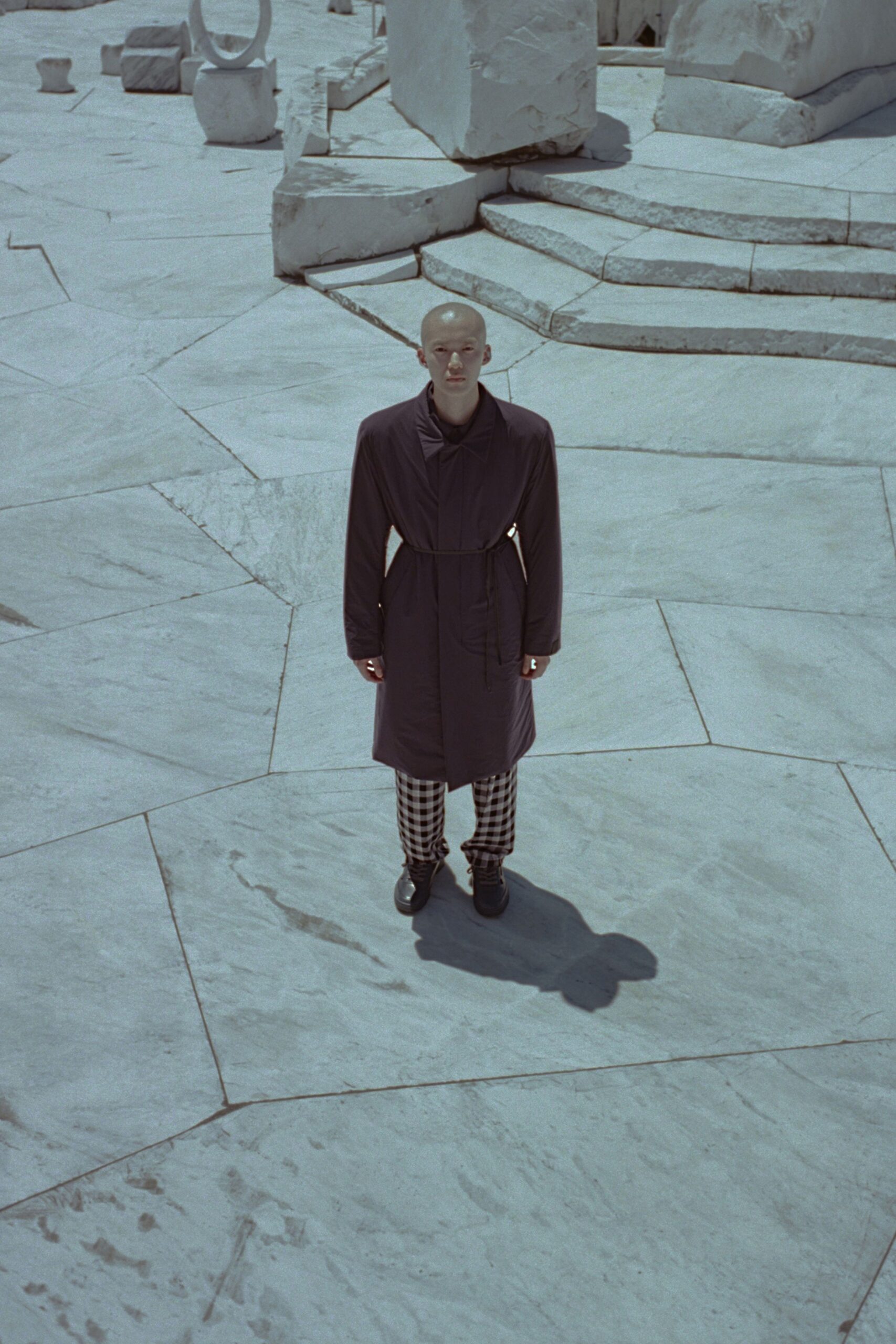 black coat with checked pants