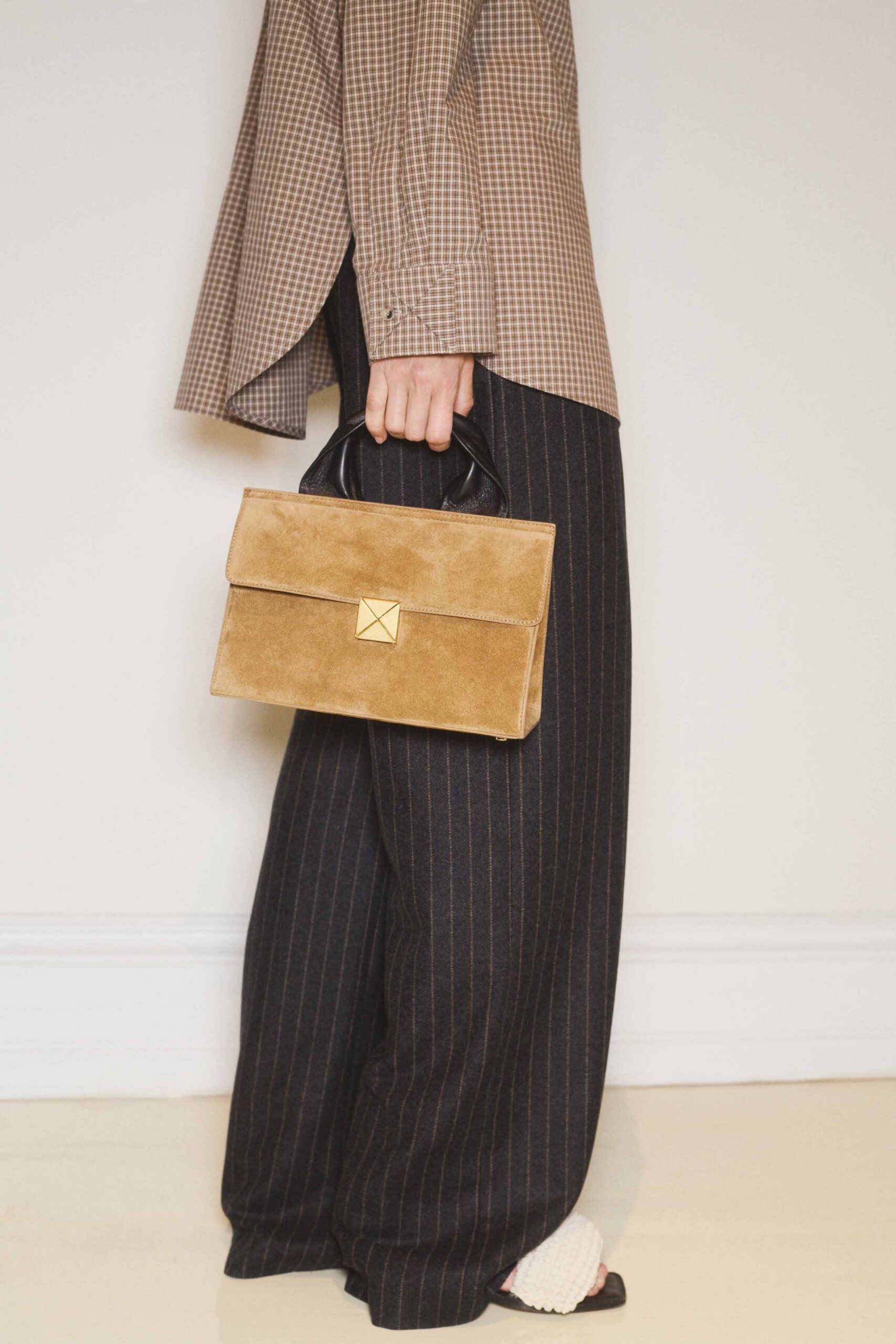 brown checked shirt with black pants