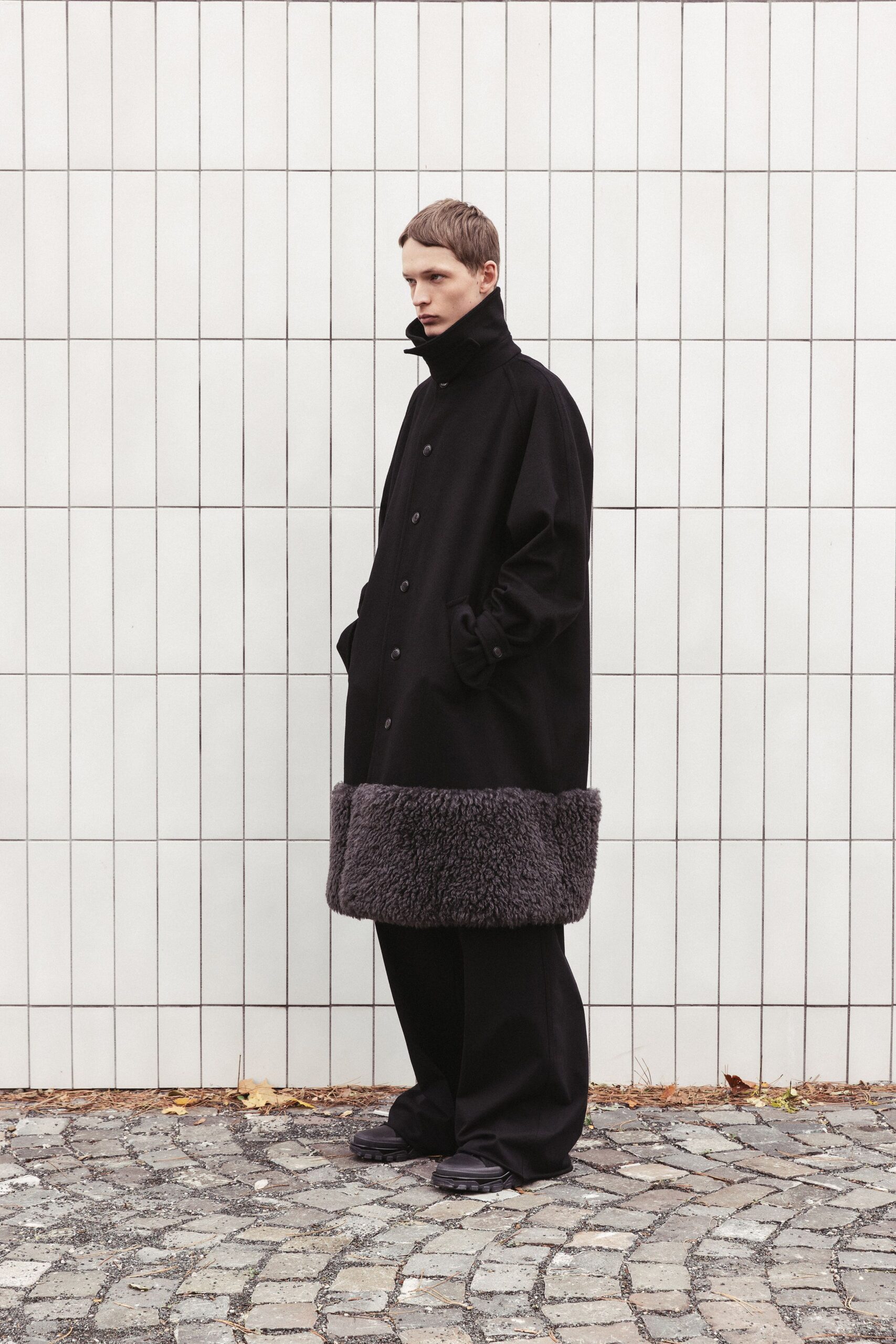 black wool long-sleeve collared oversized buttoned coat