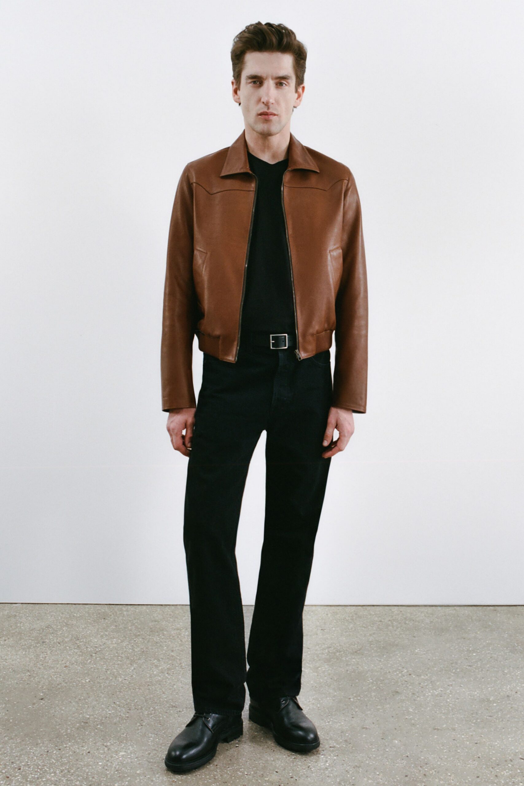 brown leather jacket with black outfit