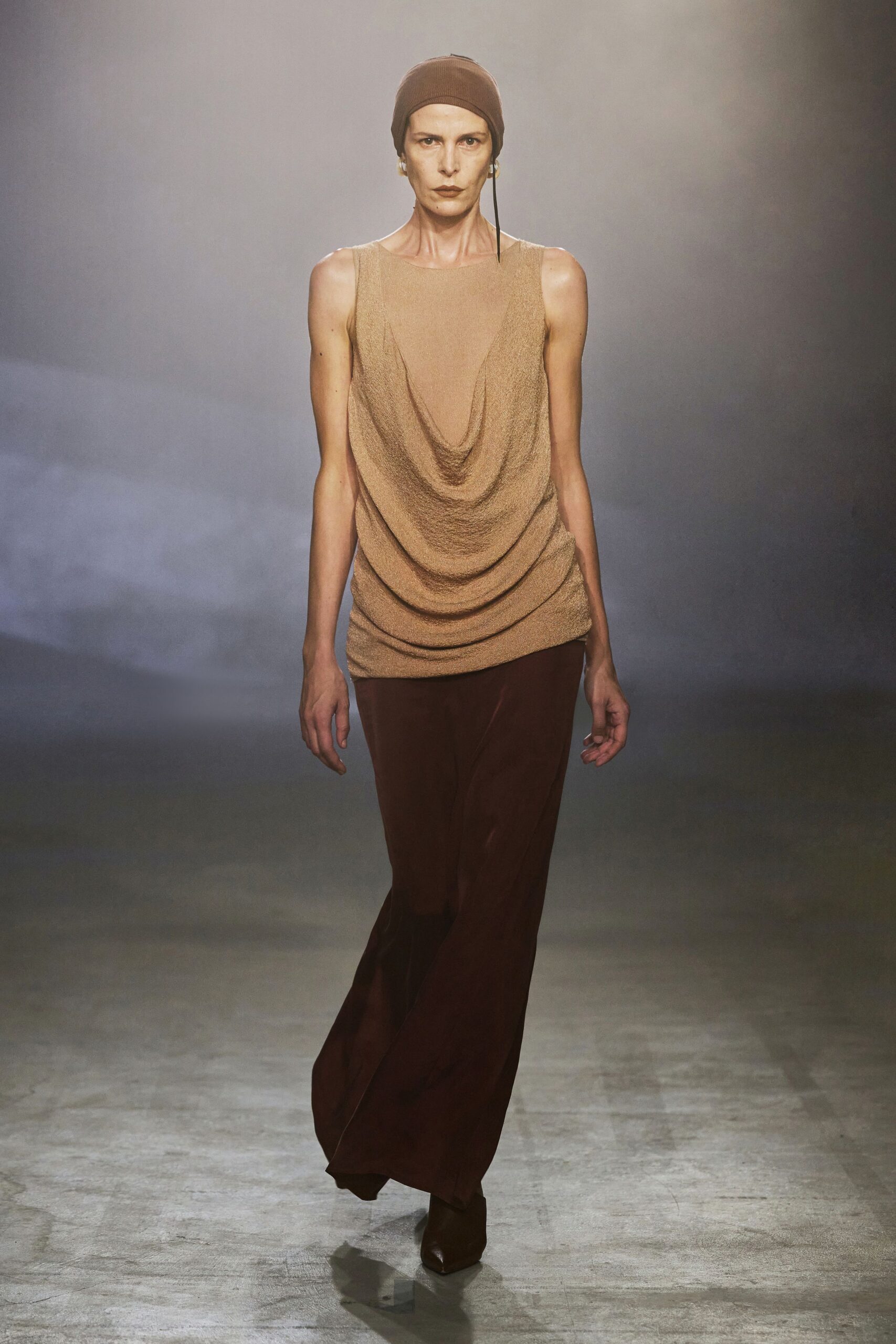 beige draped top with brown pants
