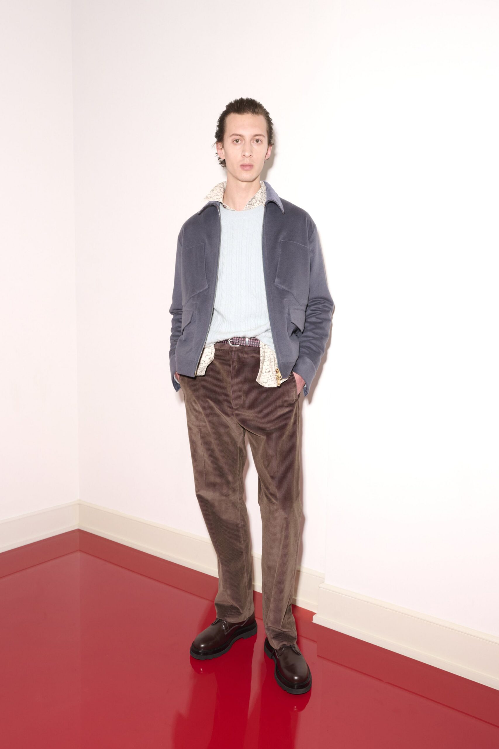 blue jacket white shirt brown pants