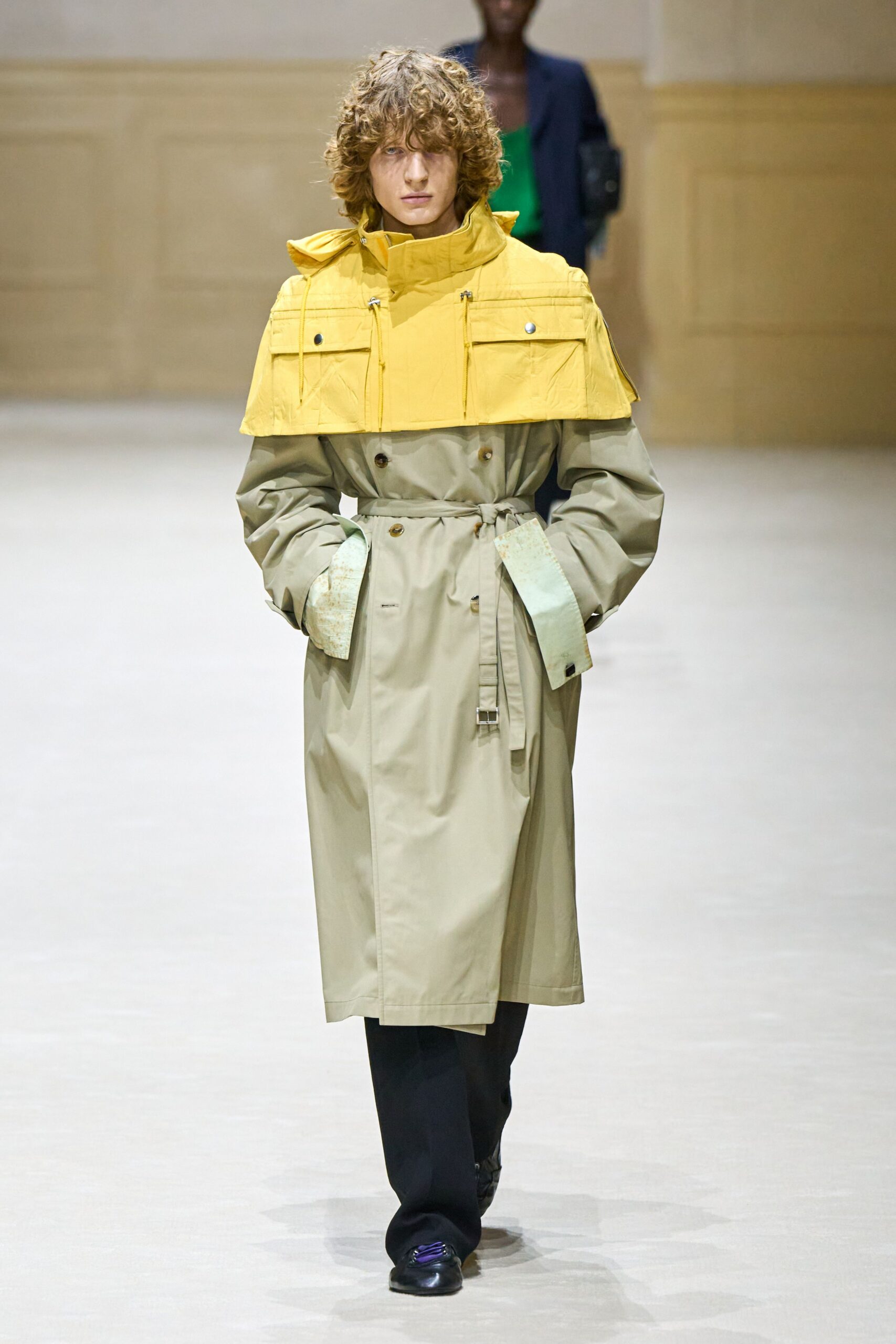 beige yellow trench coat with black pants