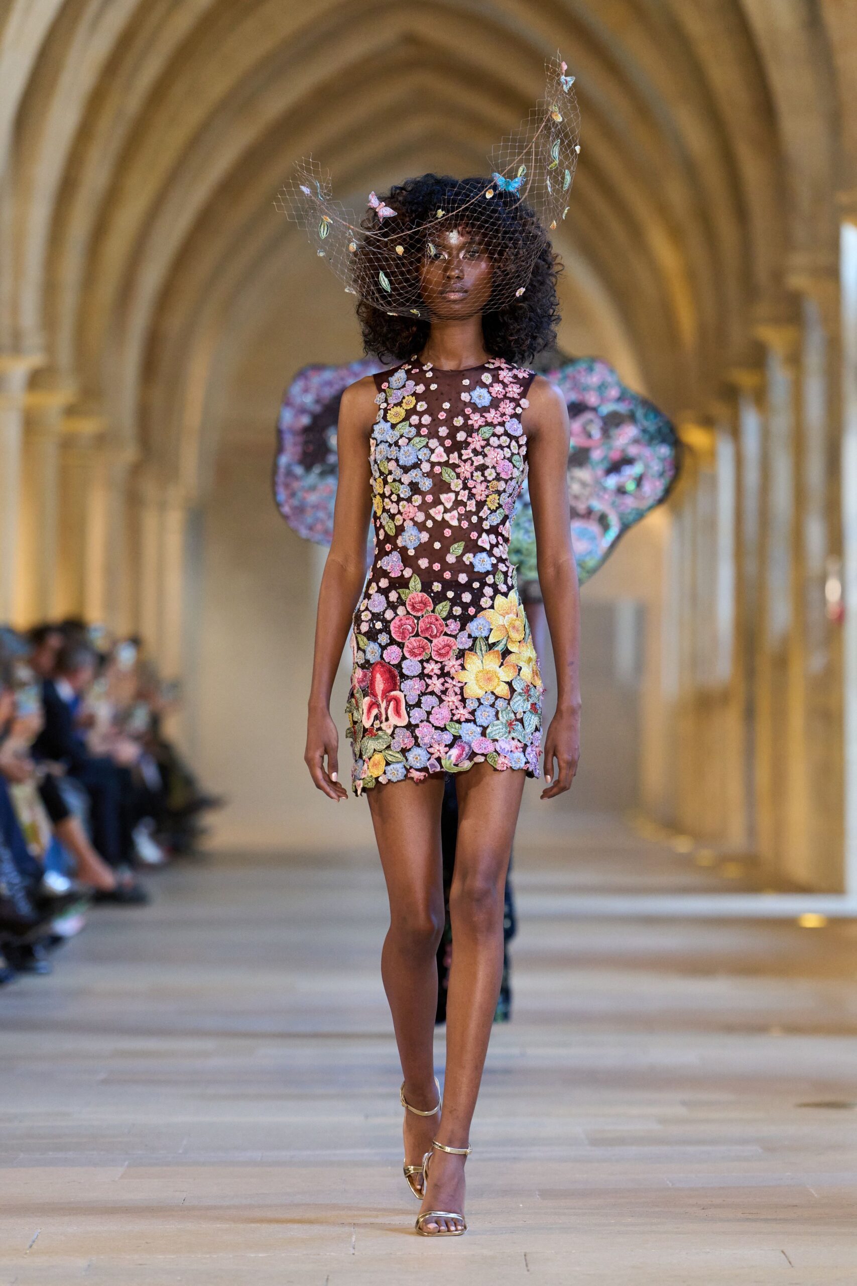 black floral mini-dress with cape