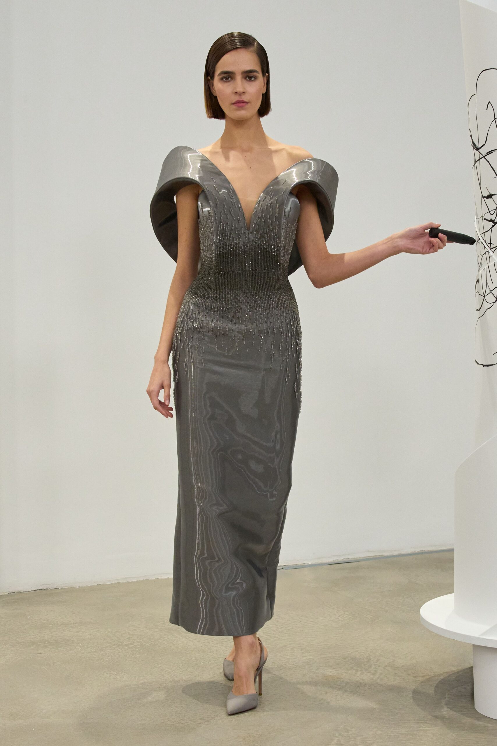 gray metallic sleeveless v-neck fitted beaded draped gown