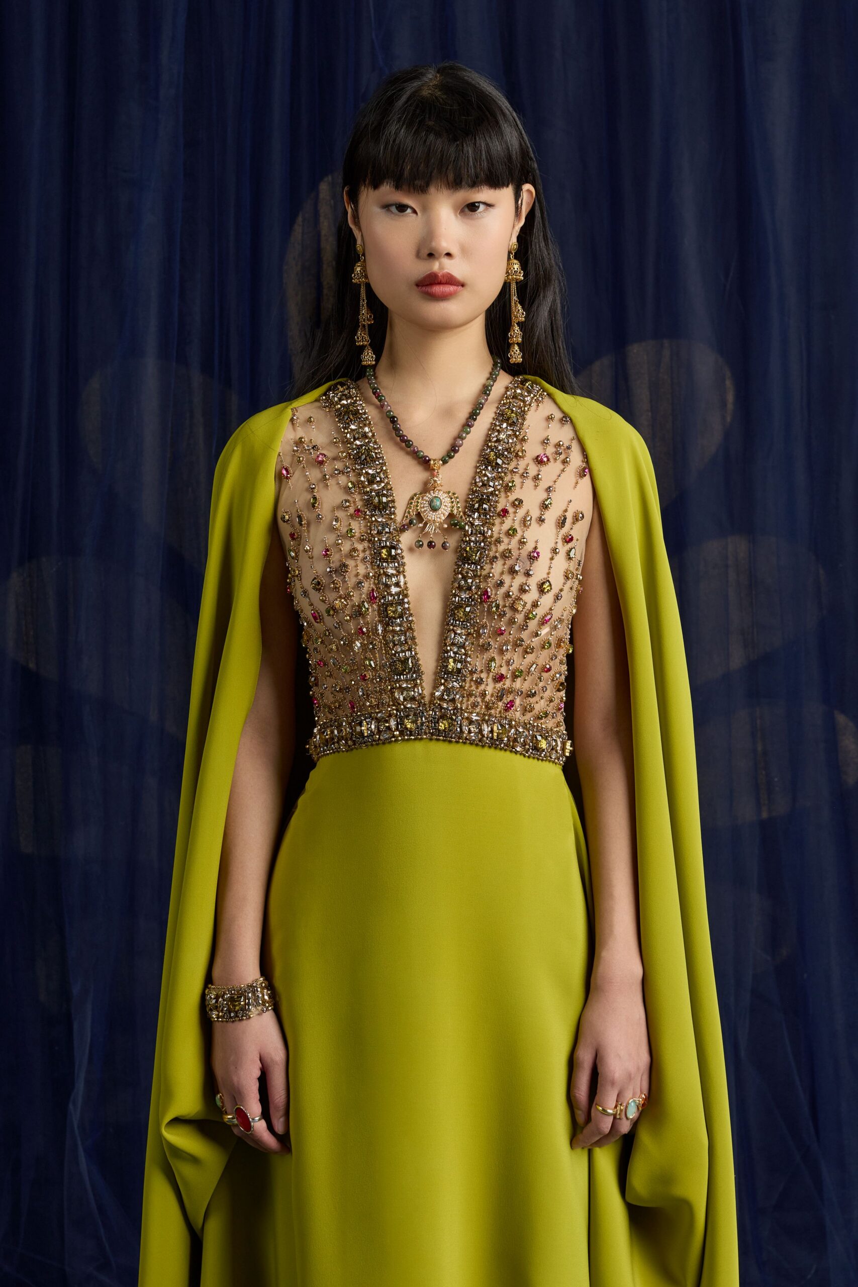 green silk sleeveless v-neck fitted embellished layered gown