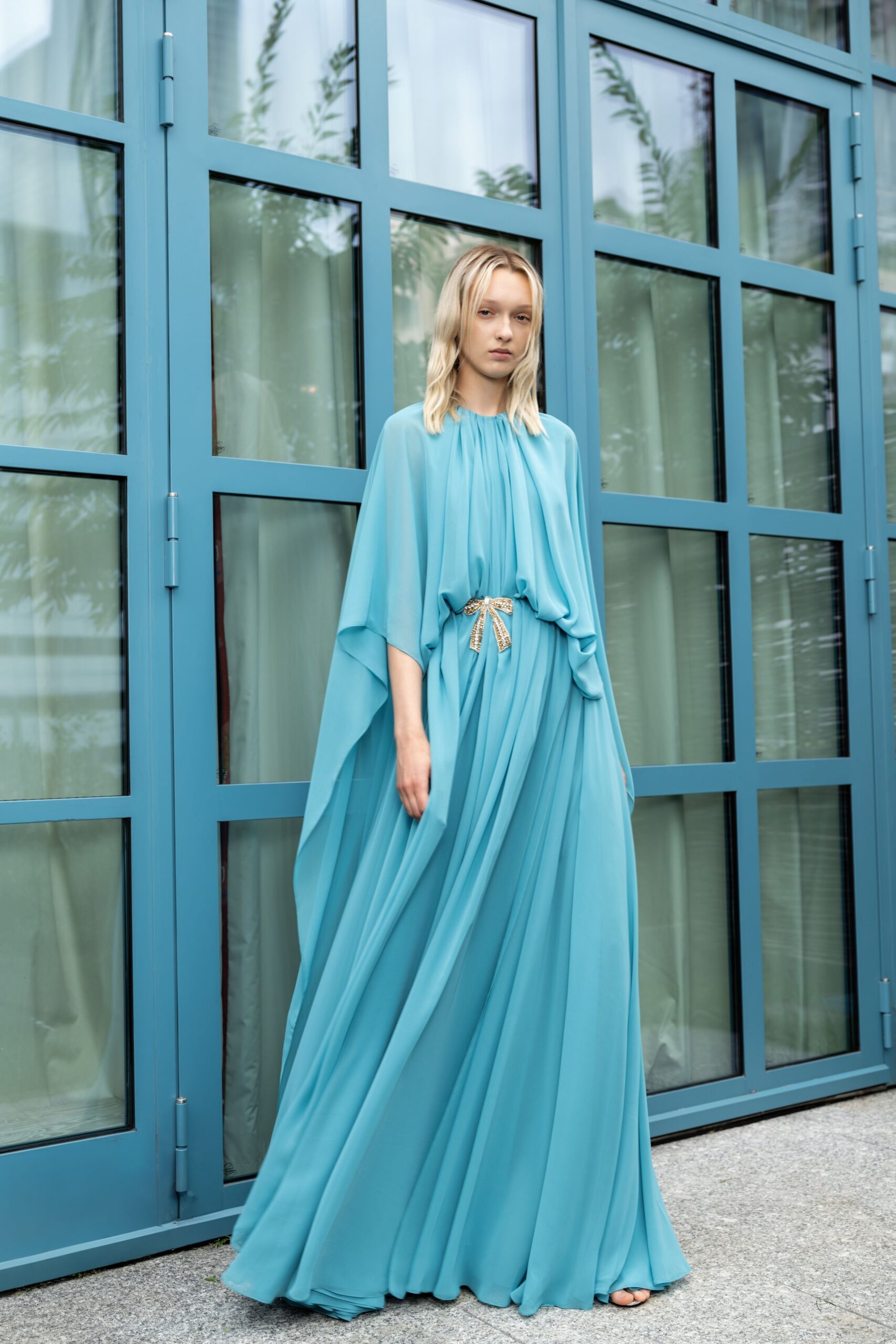 blue chiffon sleeveless high-neck relaxed draped flowing gown