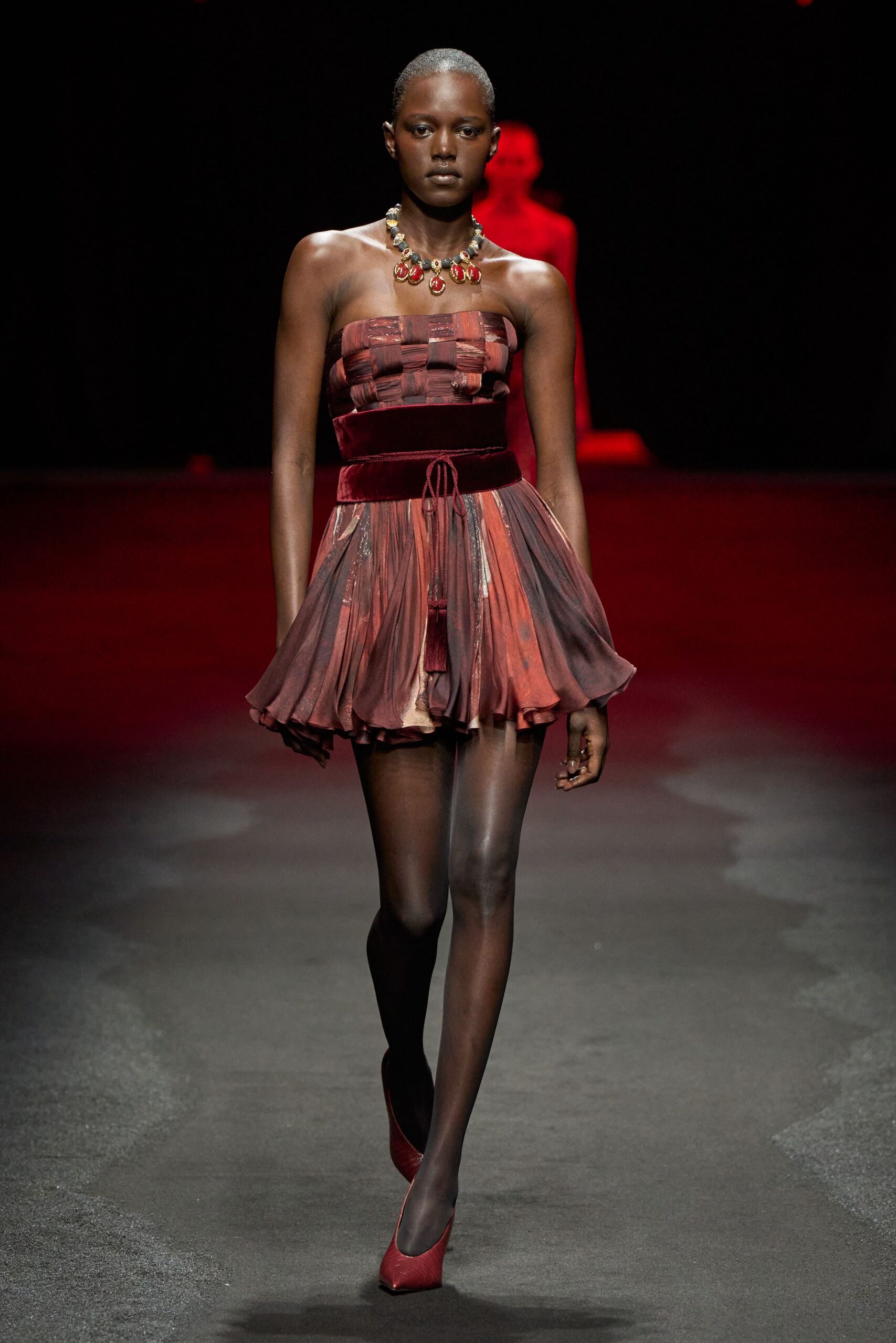 red silk strapless fitted pleated tiered flowing dress
