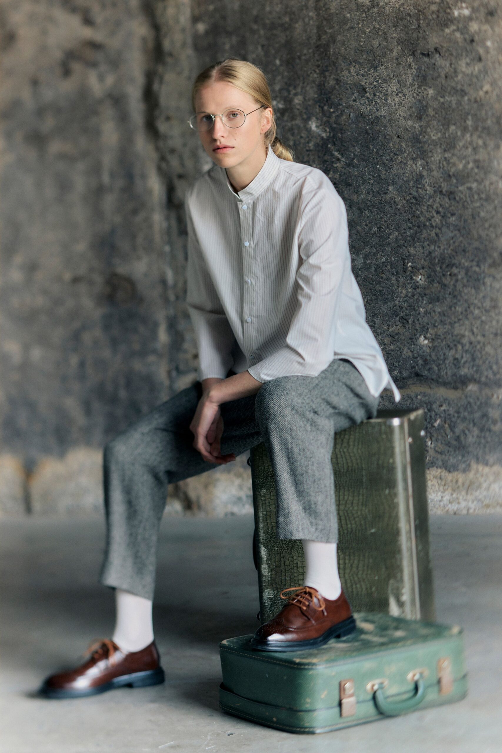 relaxed white striped shirt with gray tailored pants