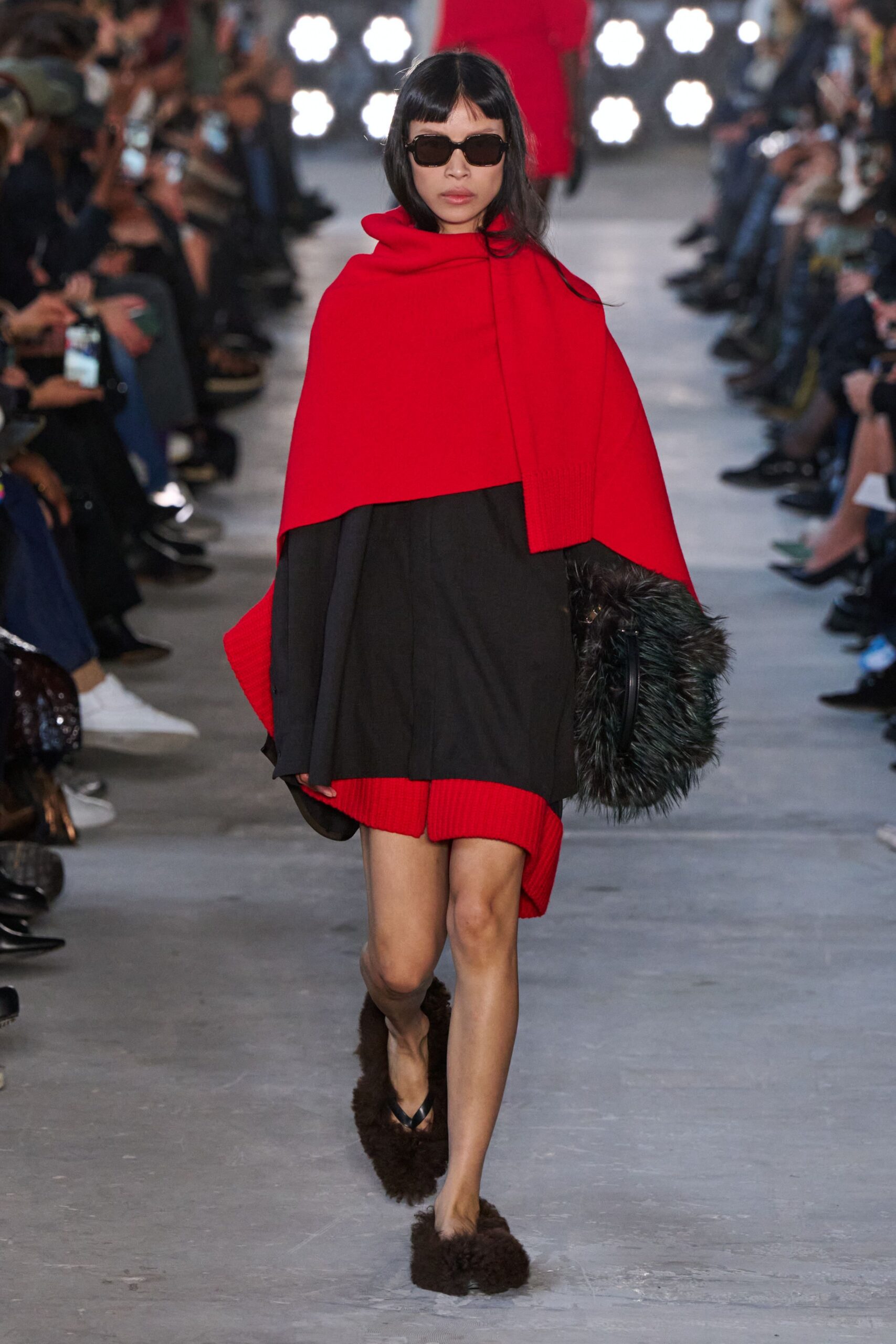 red wool cape and black dress