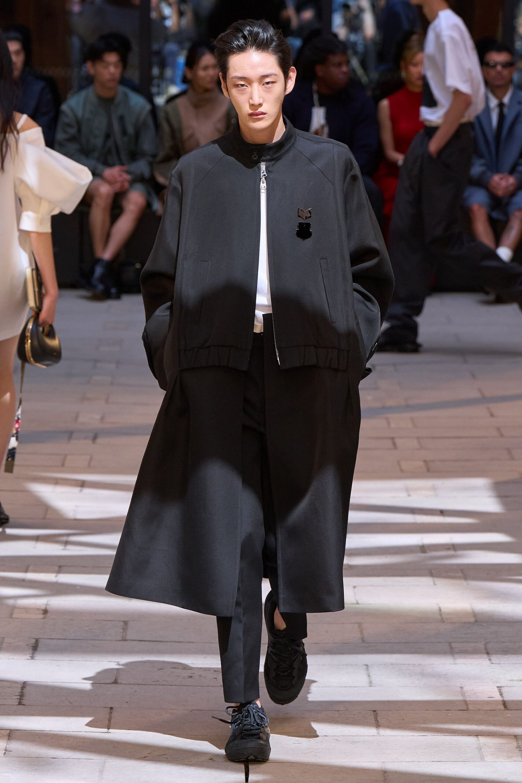 black relaxed coat with tailored pants