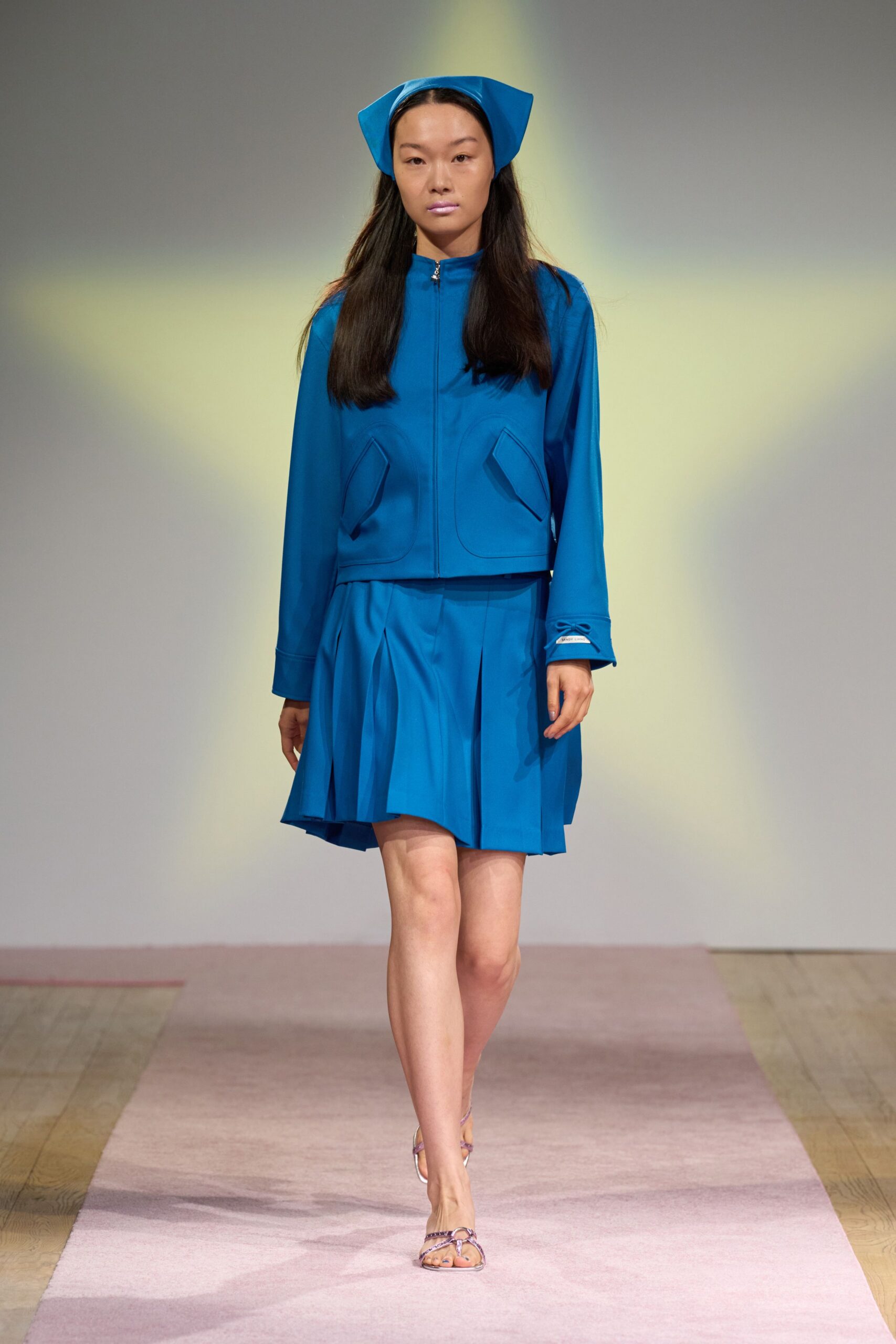 blue long-sleeve collared fitted zippered pockets jacket