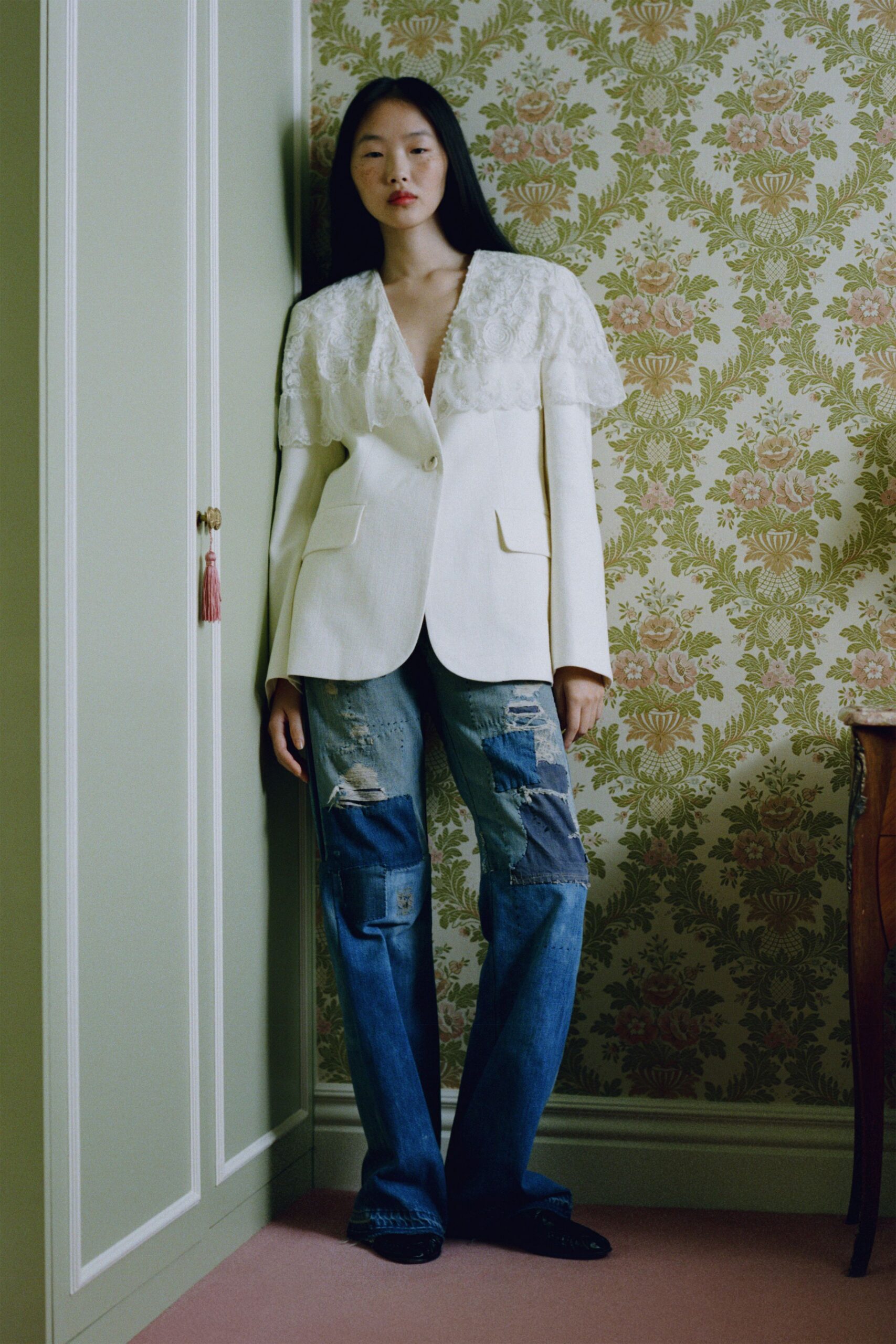 white embroidered blazer and blue jeans
