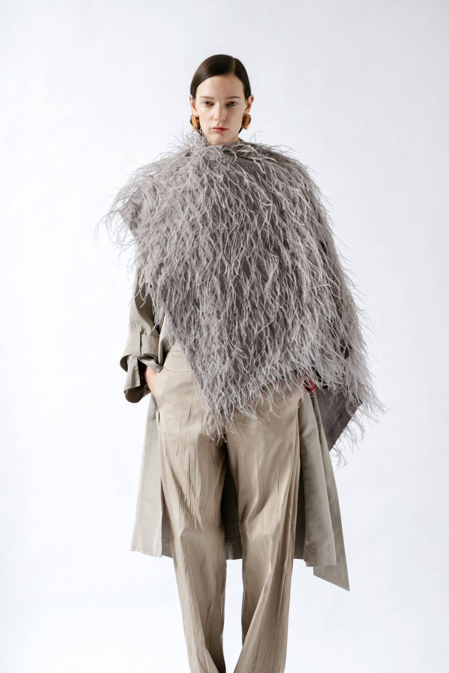 gray fringed poncho with beige trench