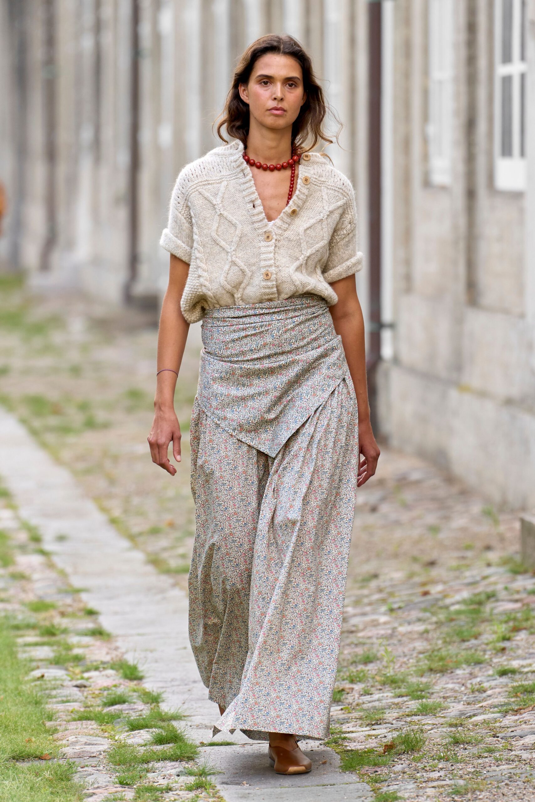 beige wool sweater and multi skirt