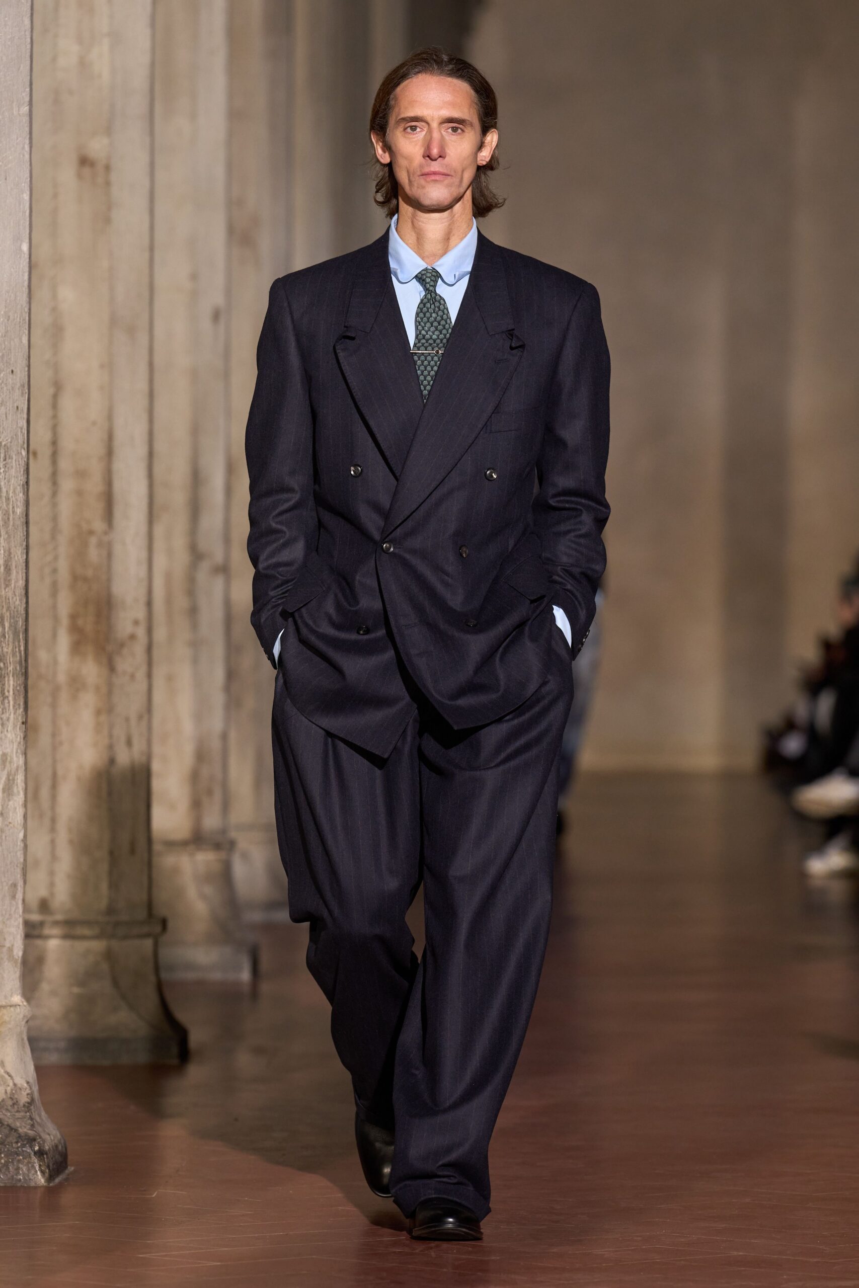 black tailored suit with blue shirt