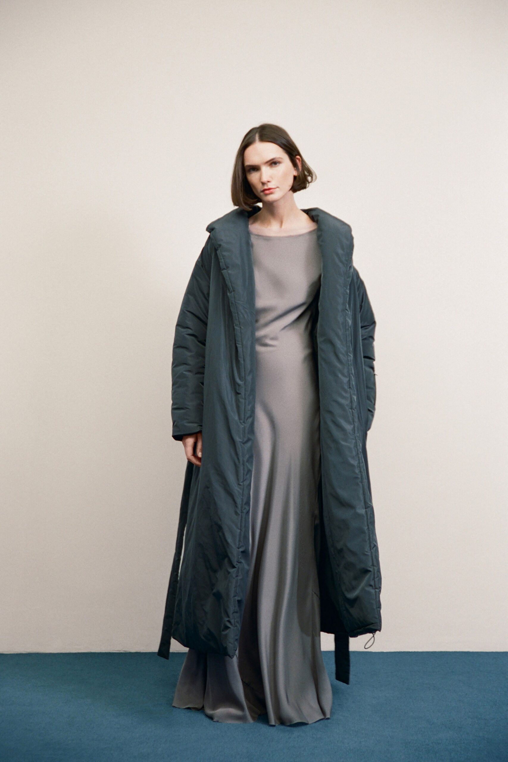 gray silk long-sleeve high-neck fitted flowing maxi gown