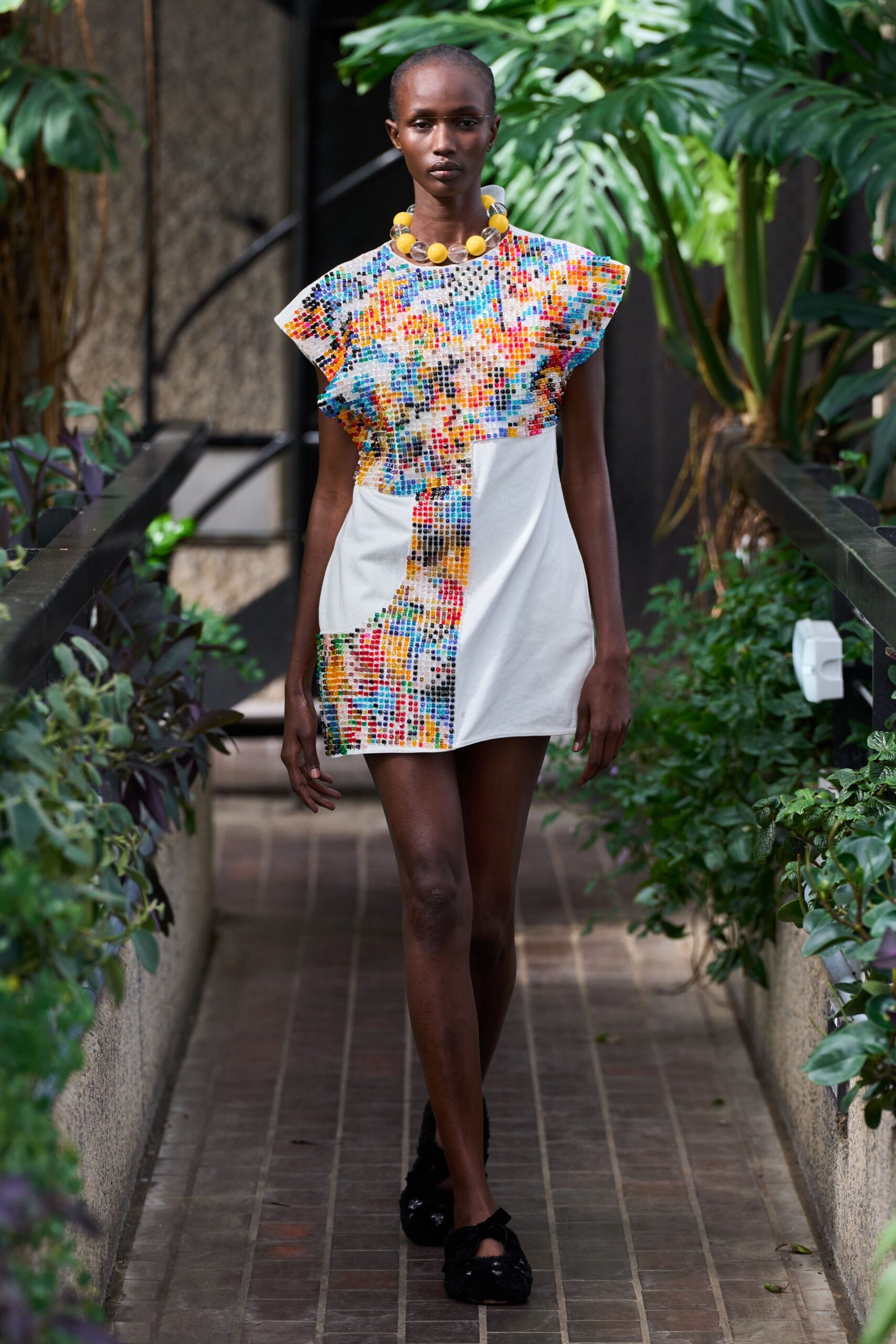 multi-colored mini dress with black shoes