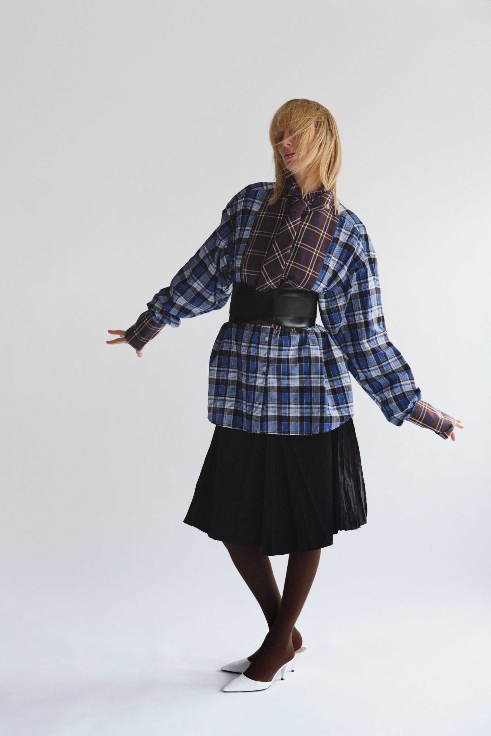 relaxed blue checked shirt with black pleated skirt