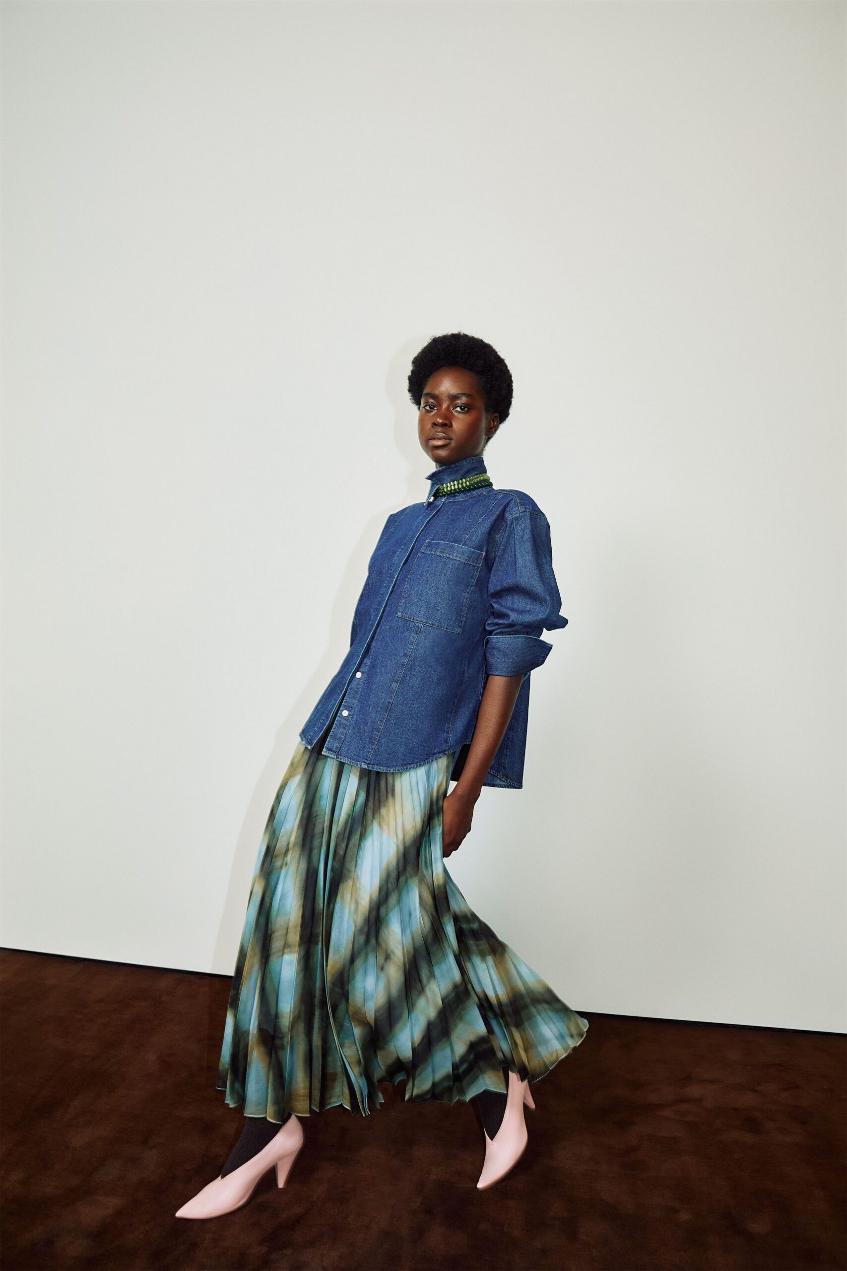 green silk fitted high-waisted pleated flowing maxi skirt