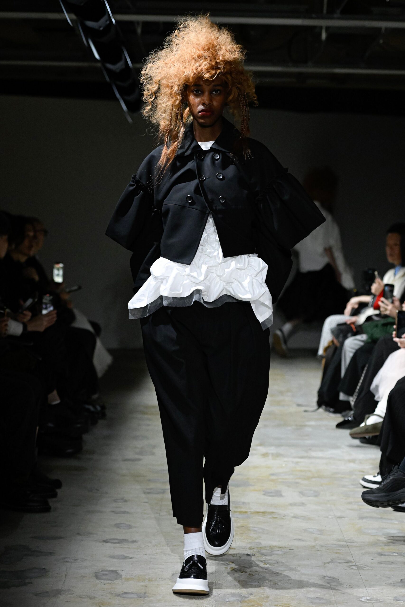 black structured jacket with white top