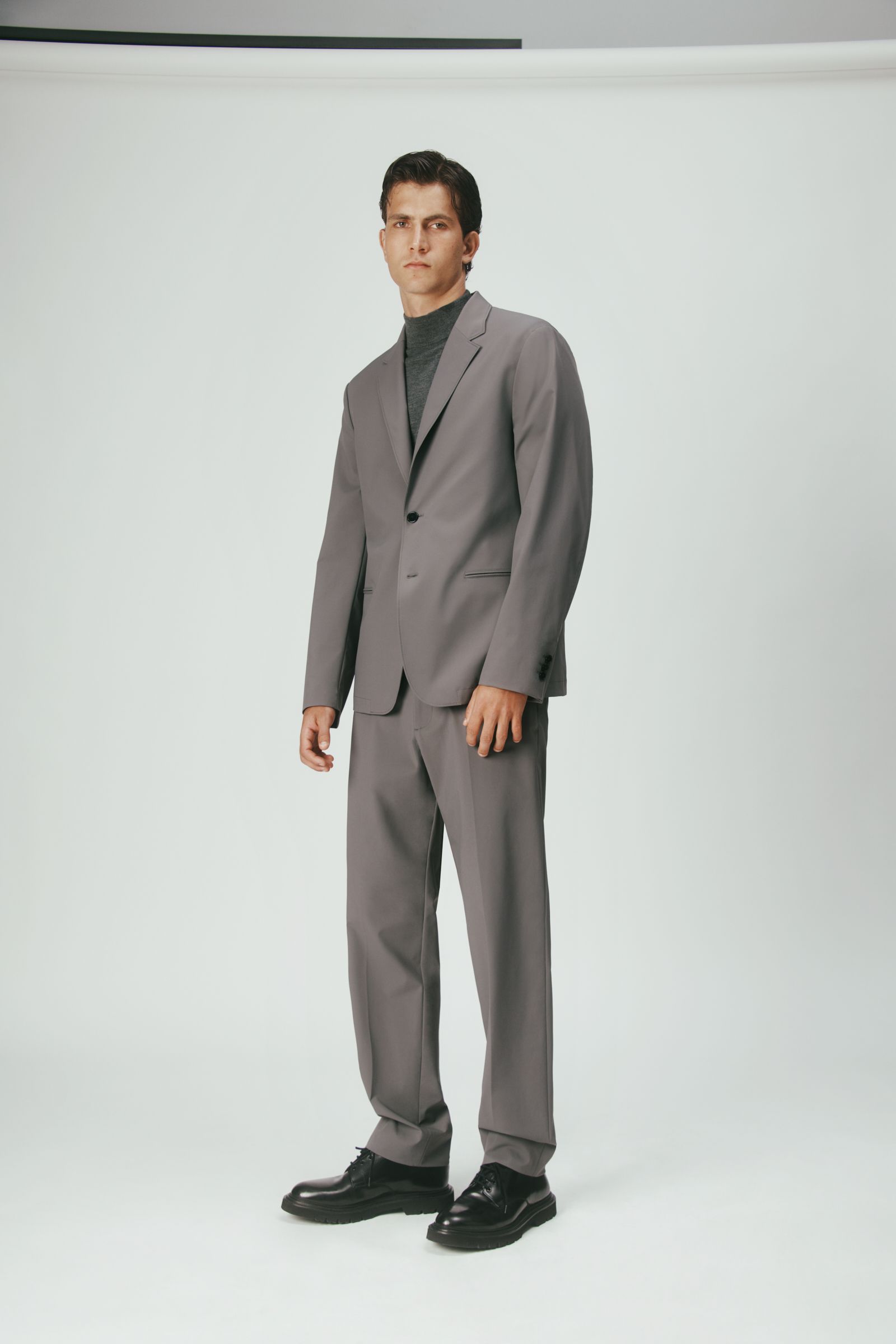 gray tailored suit with black shoes