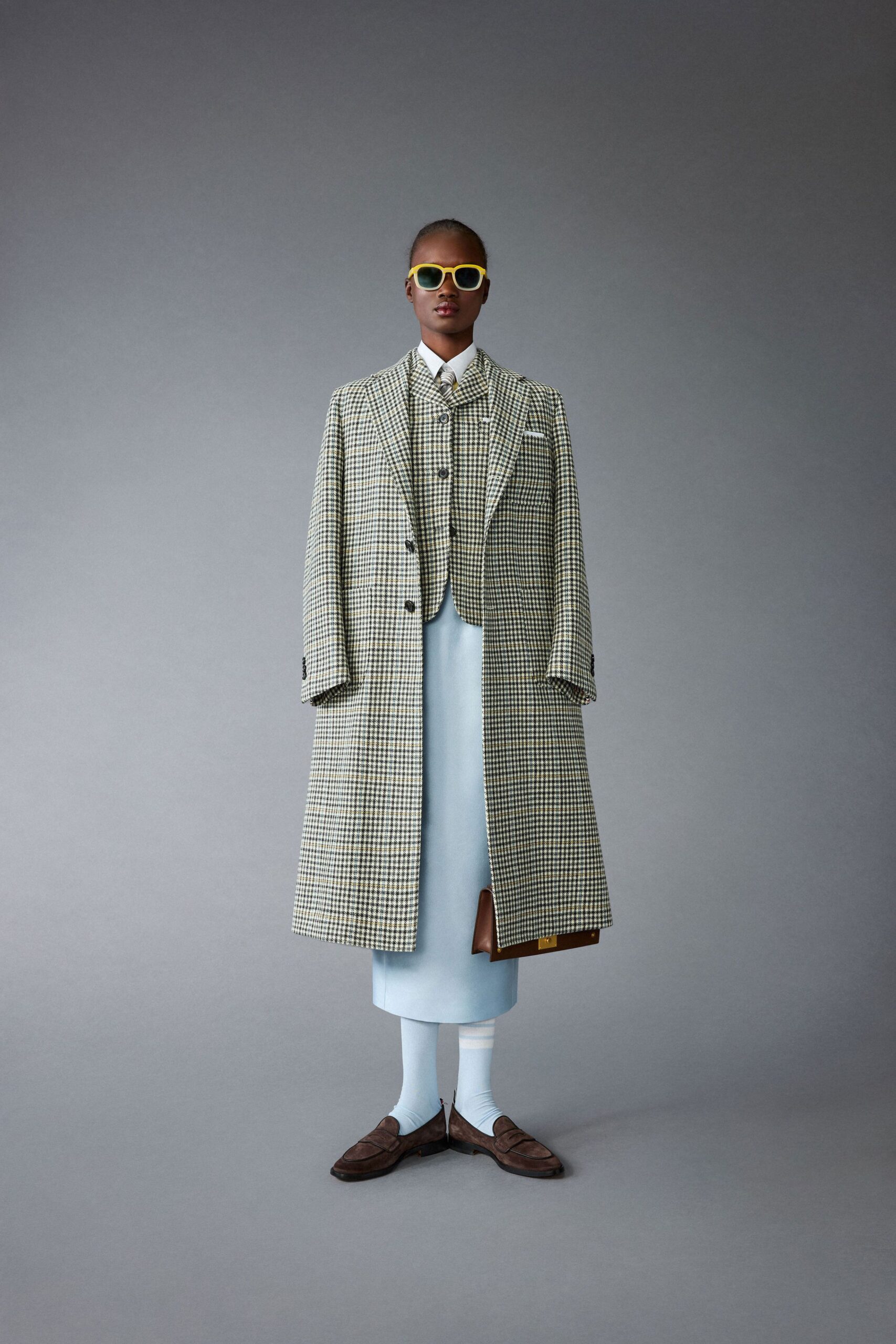 checked coat with tailored suit