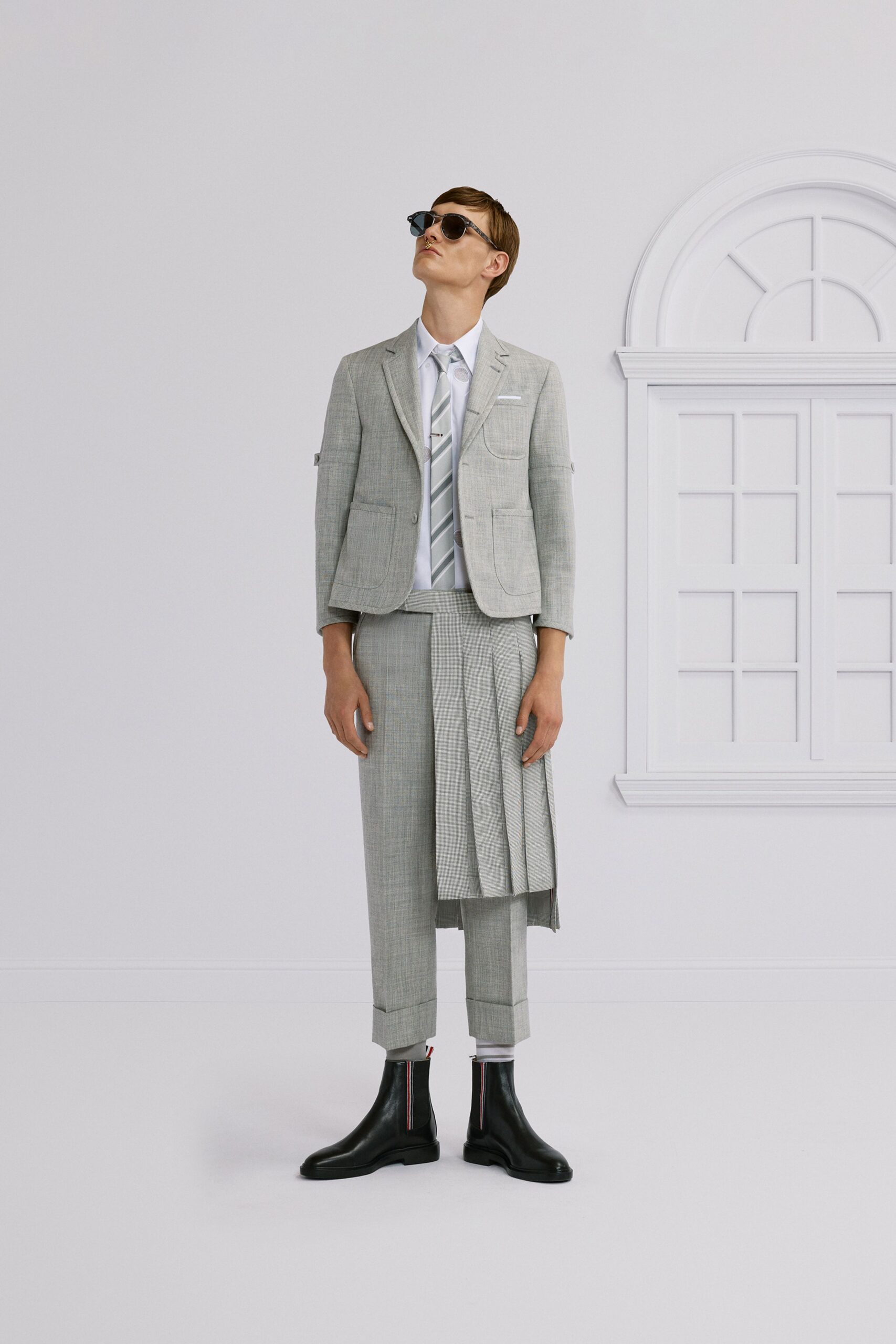 gray tailored suit with sunglasses