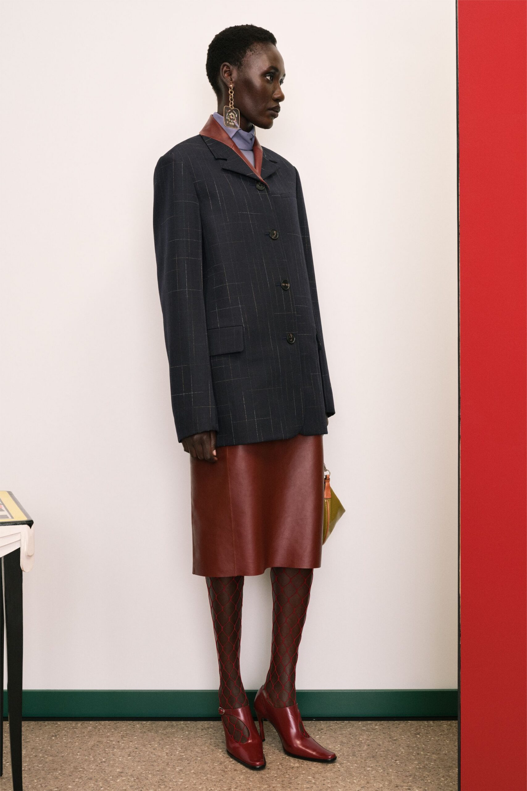 oversized black blazer with red skirt