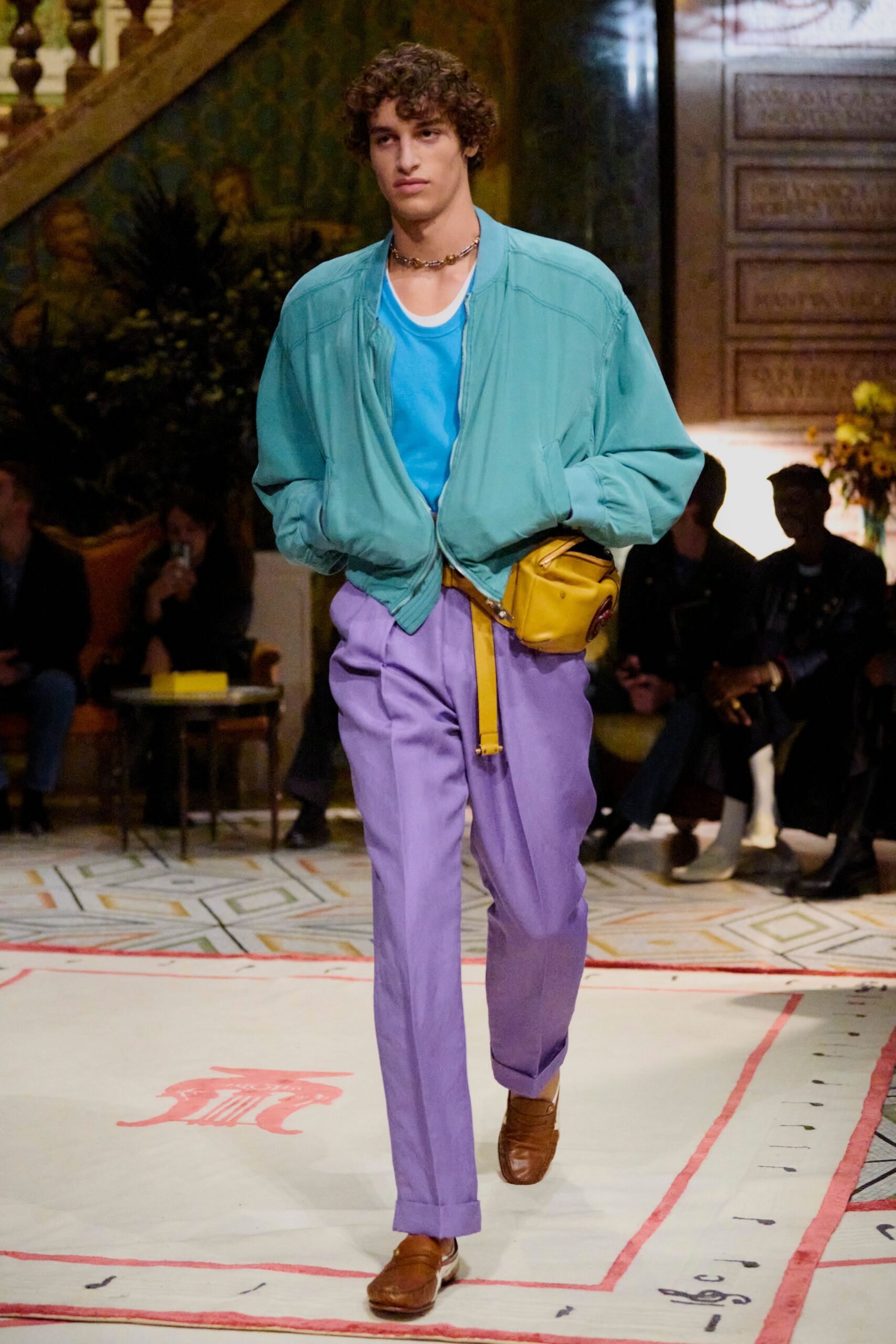 teal jacket blue t-shirt purple pants