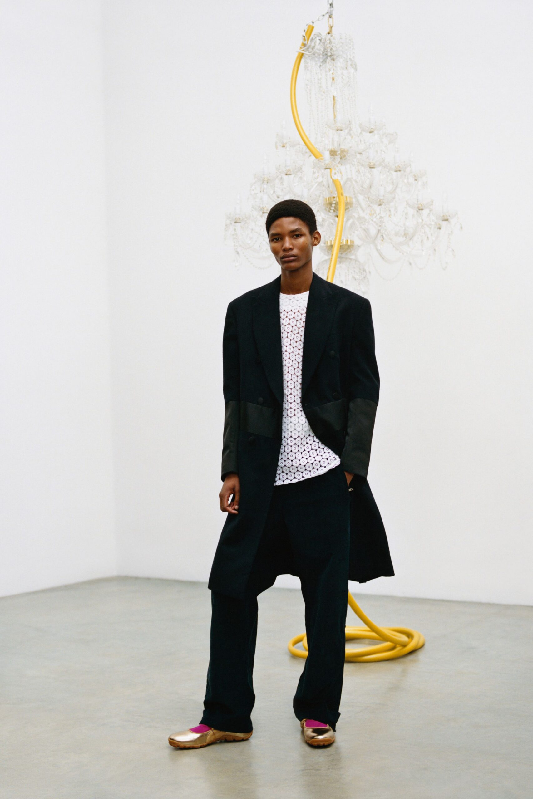 black coat white shirt relaxed pants