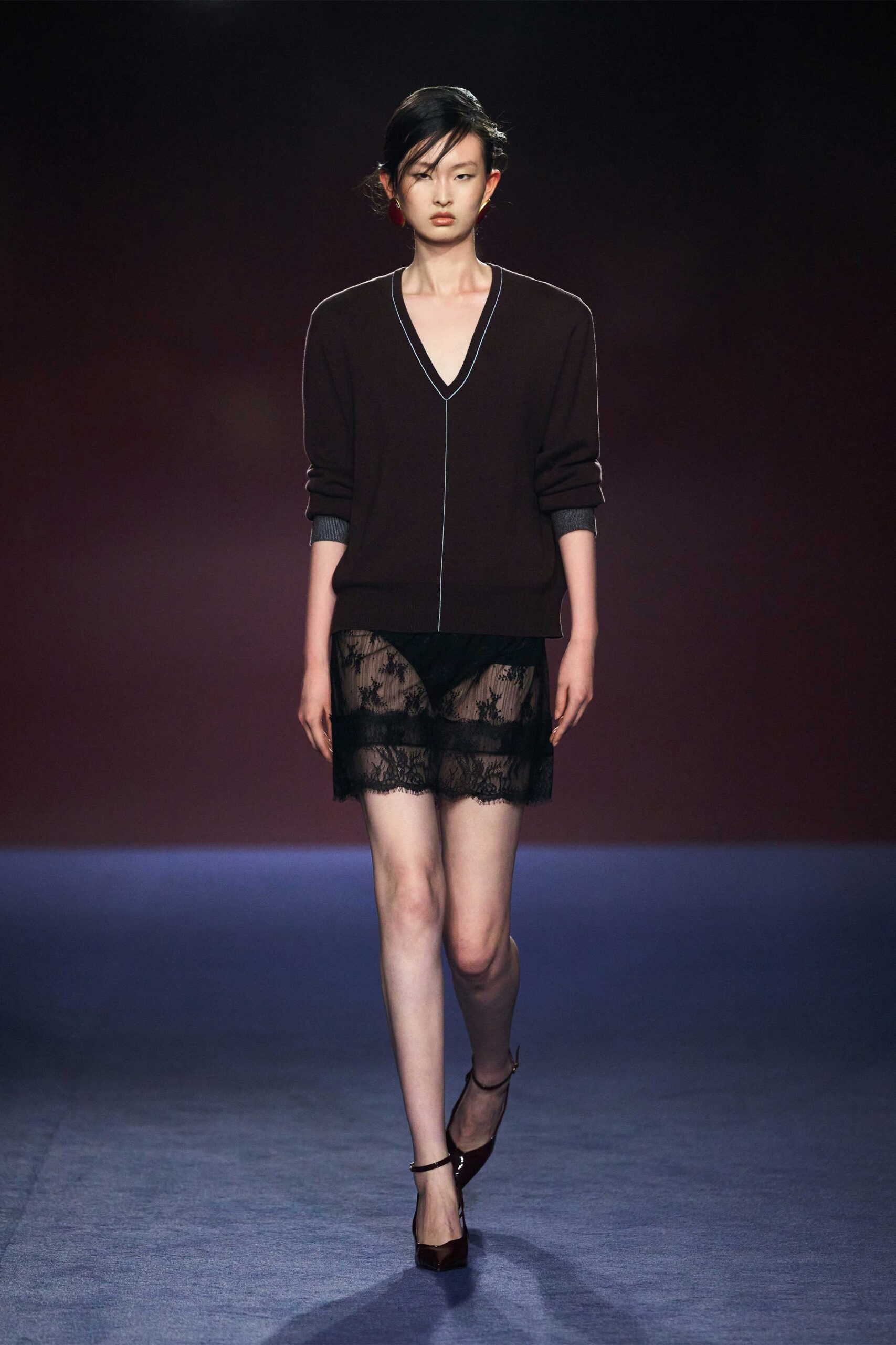 black fitted top and mini skirt