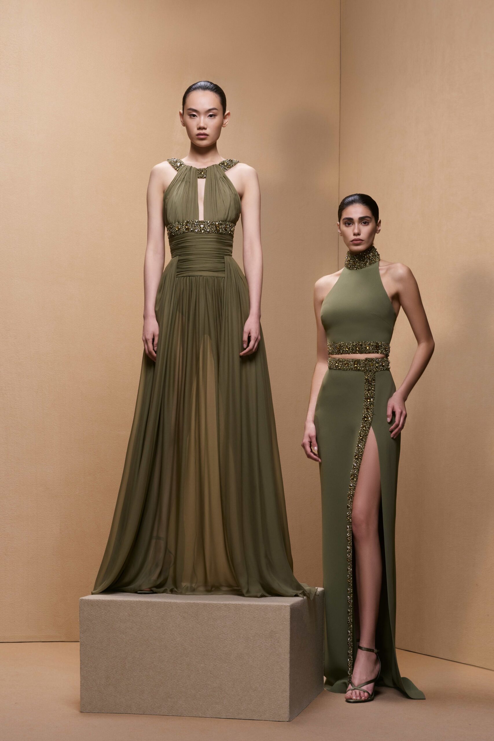 green silk sleeveless v-neck fitted pleated draped gown