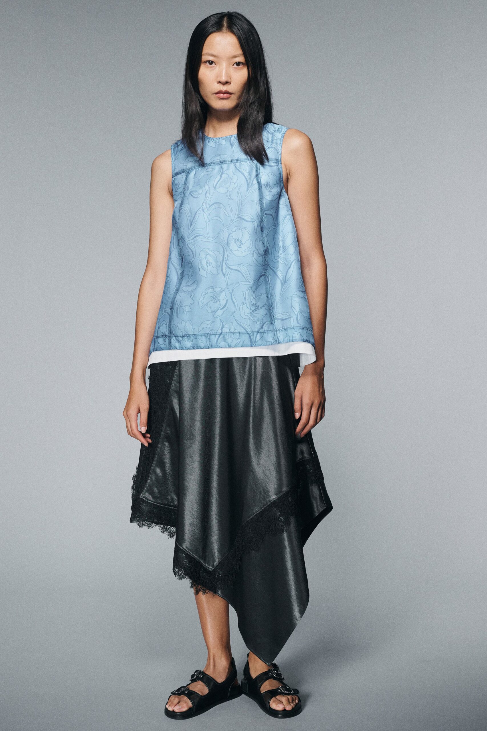 blue silk top with black asymmetric skirt