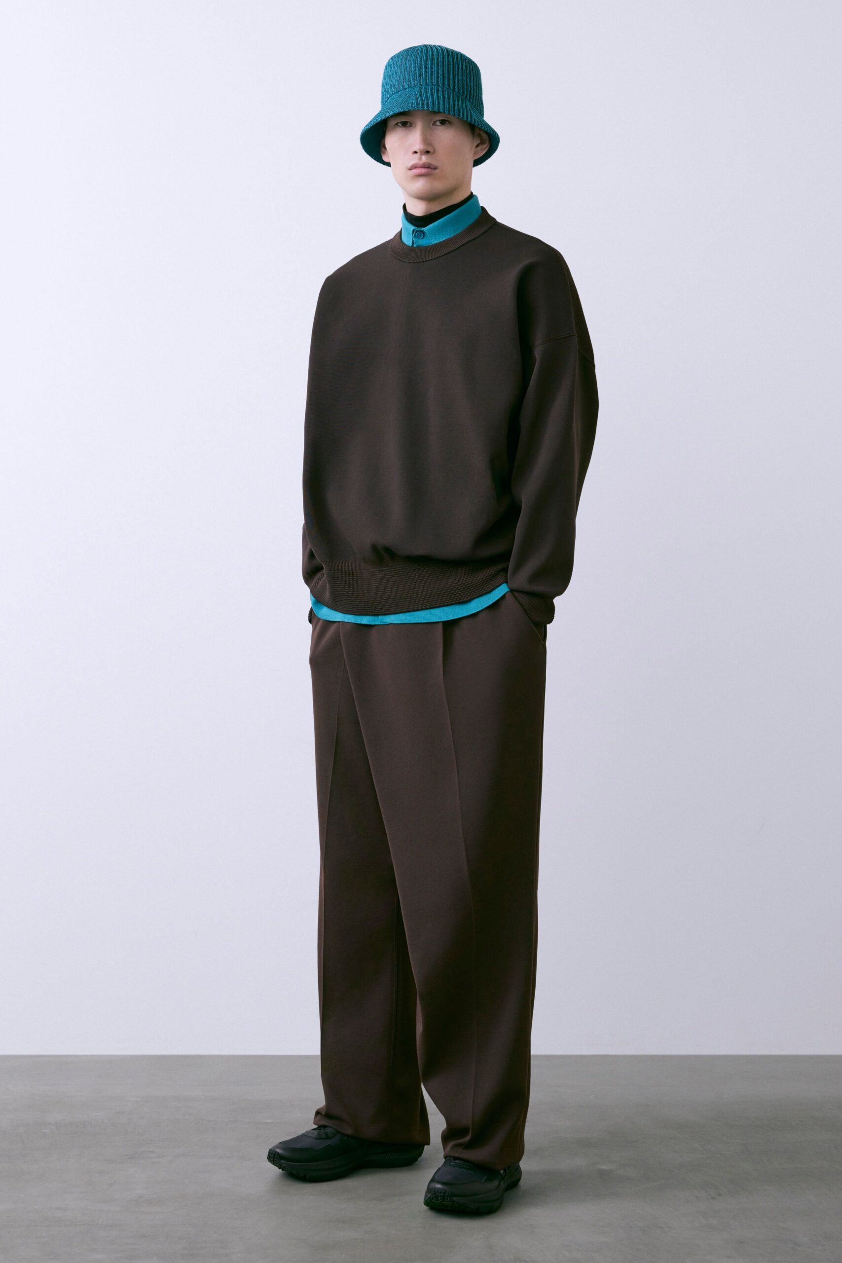 brown relaxed sweater with blue shirt