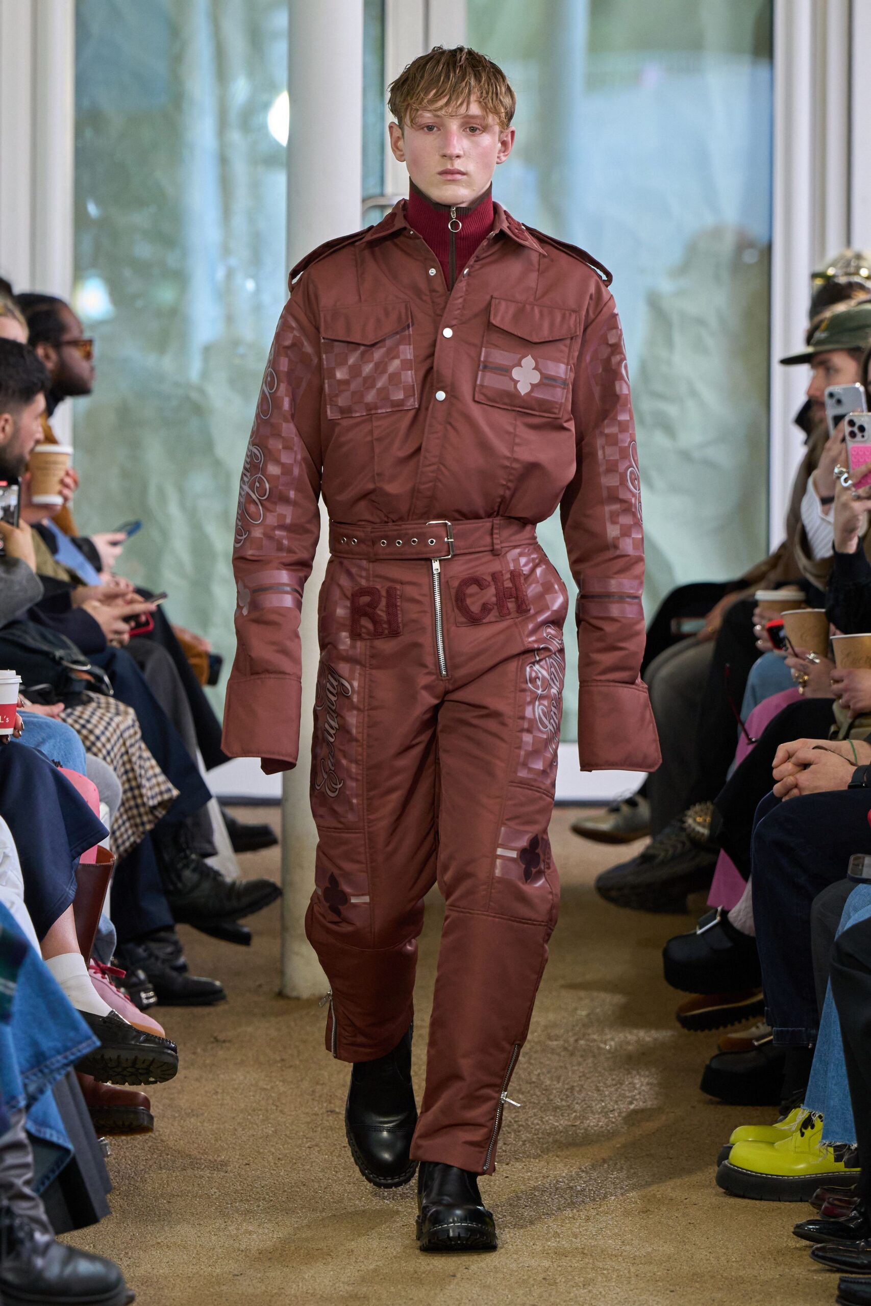 brown fitted jumpsuit with black shoes