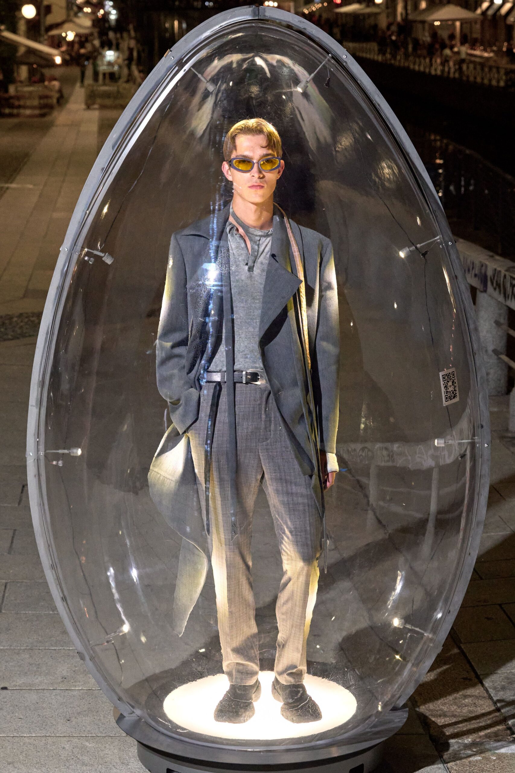 gray tailored suit with sunglasses