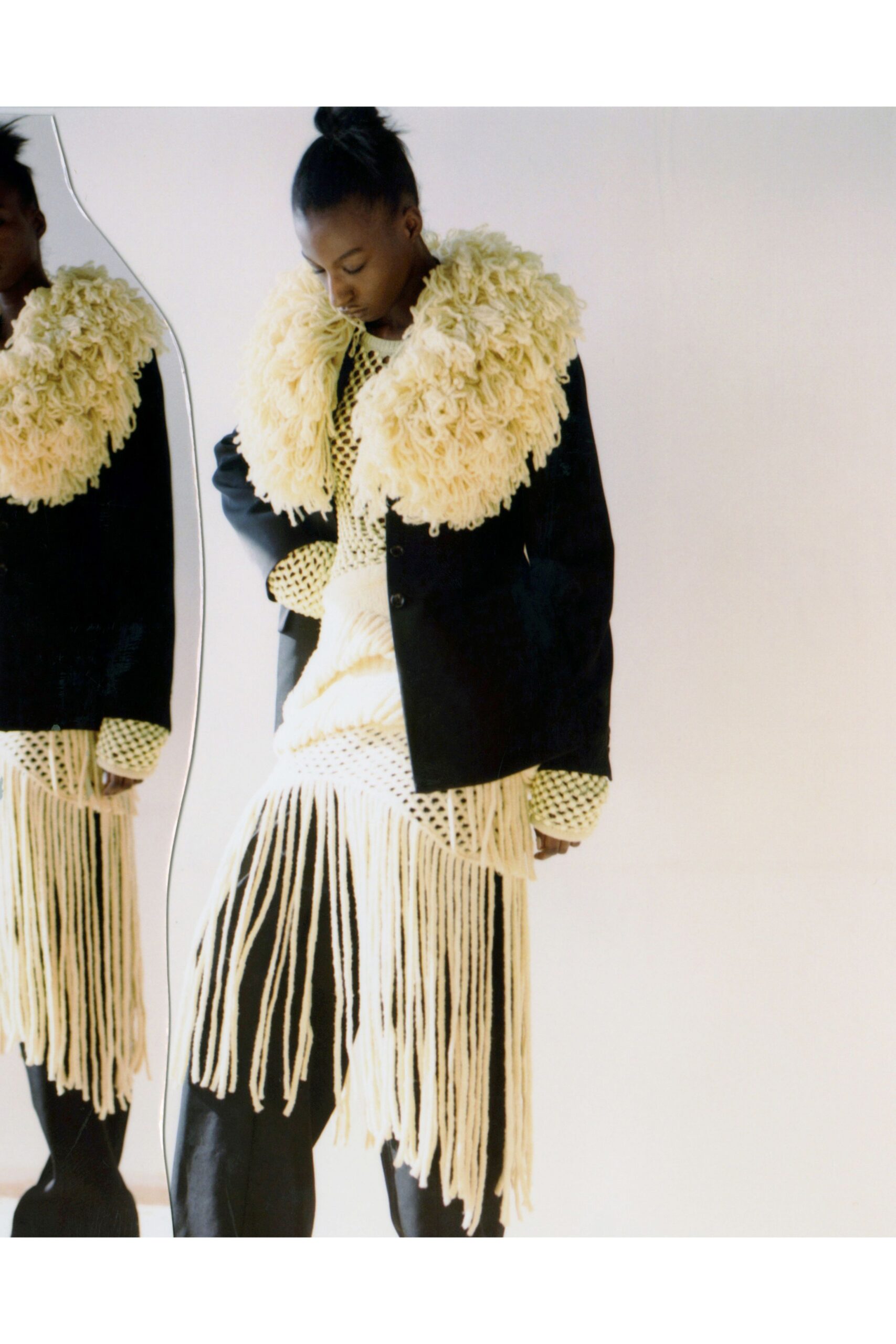 black jacket white yellow fringed dress